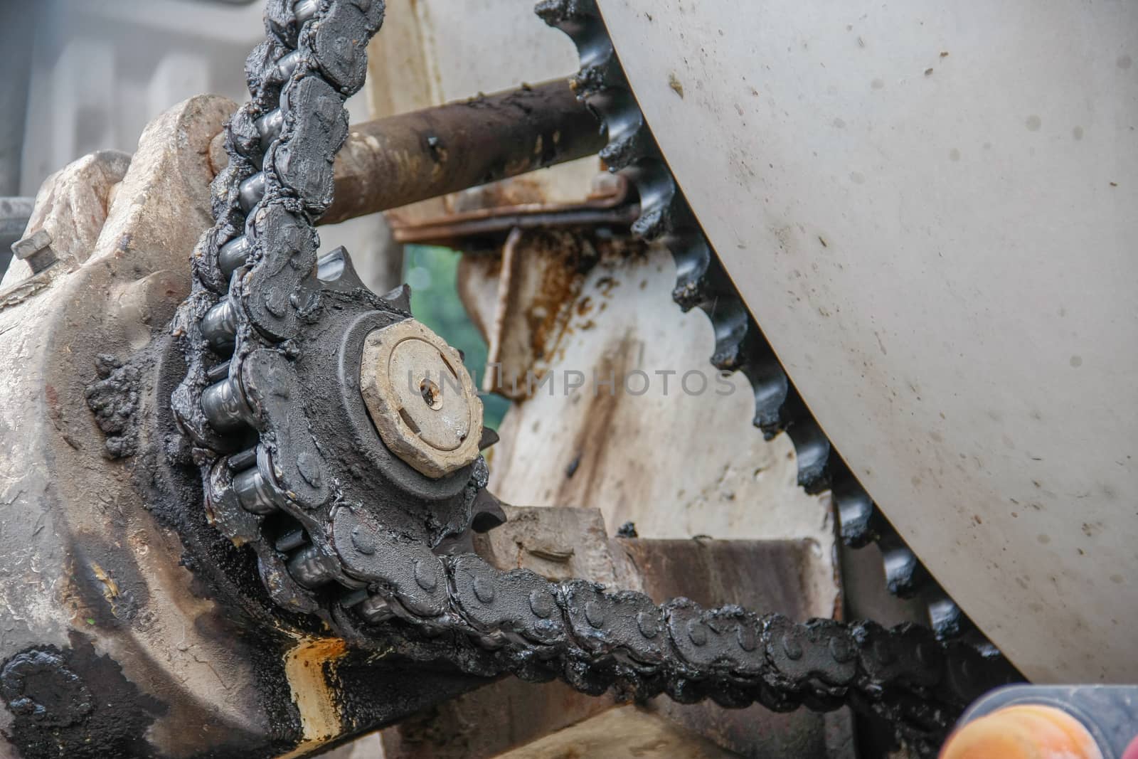 old chain with grease on propel roller for motor powered