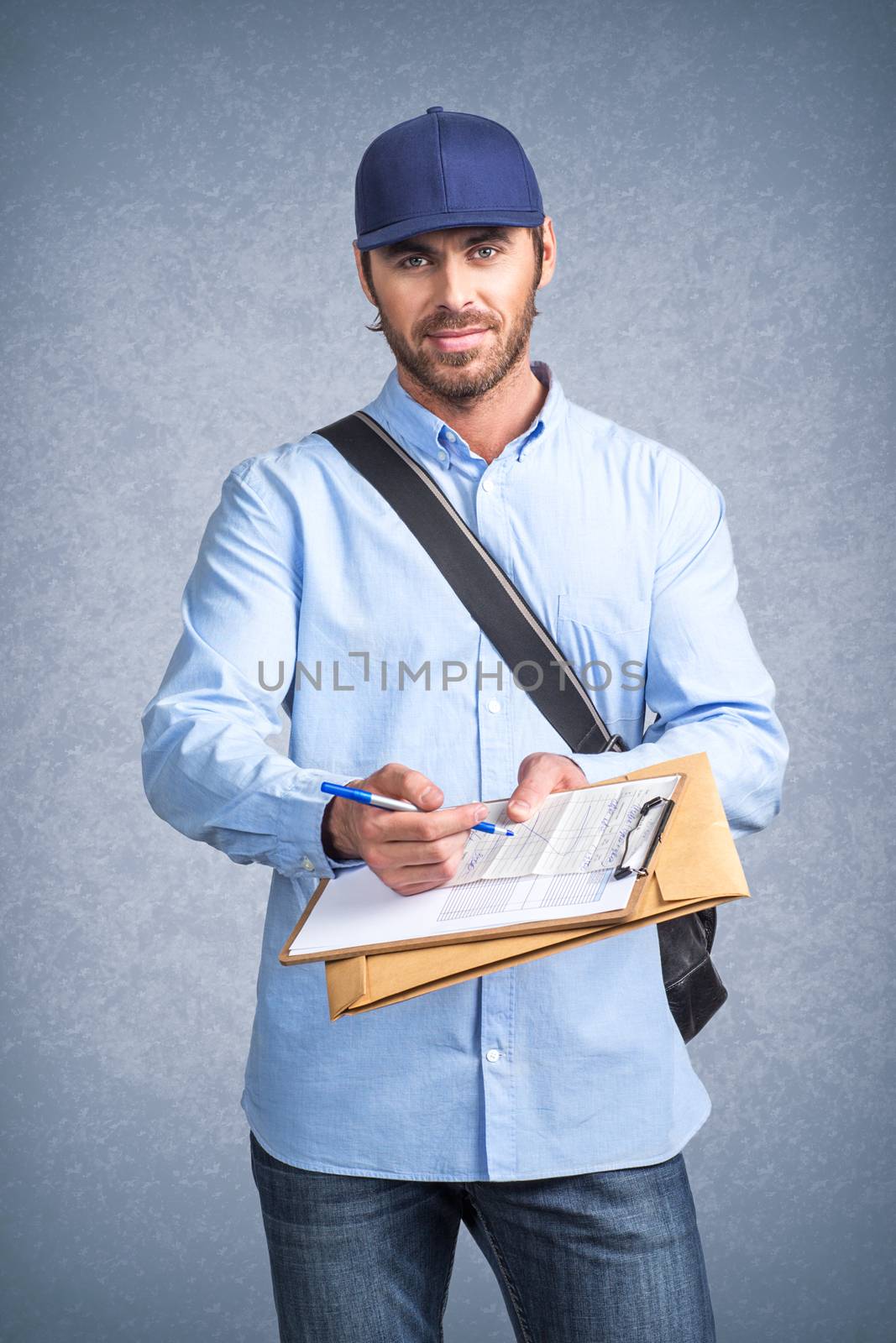 Handsome young delivery man holding document folder ask to sign invoice