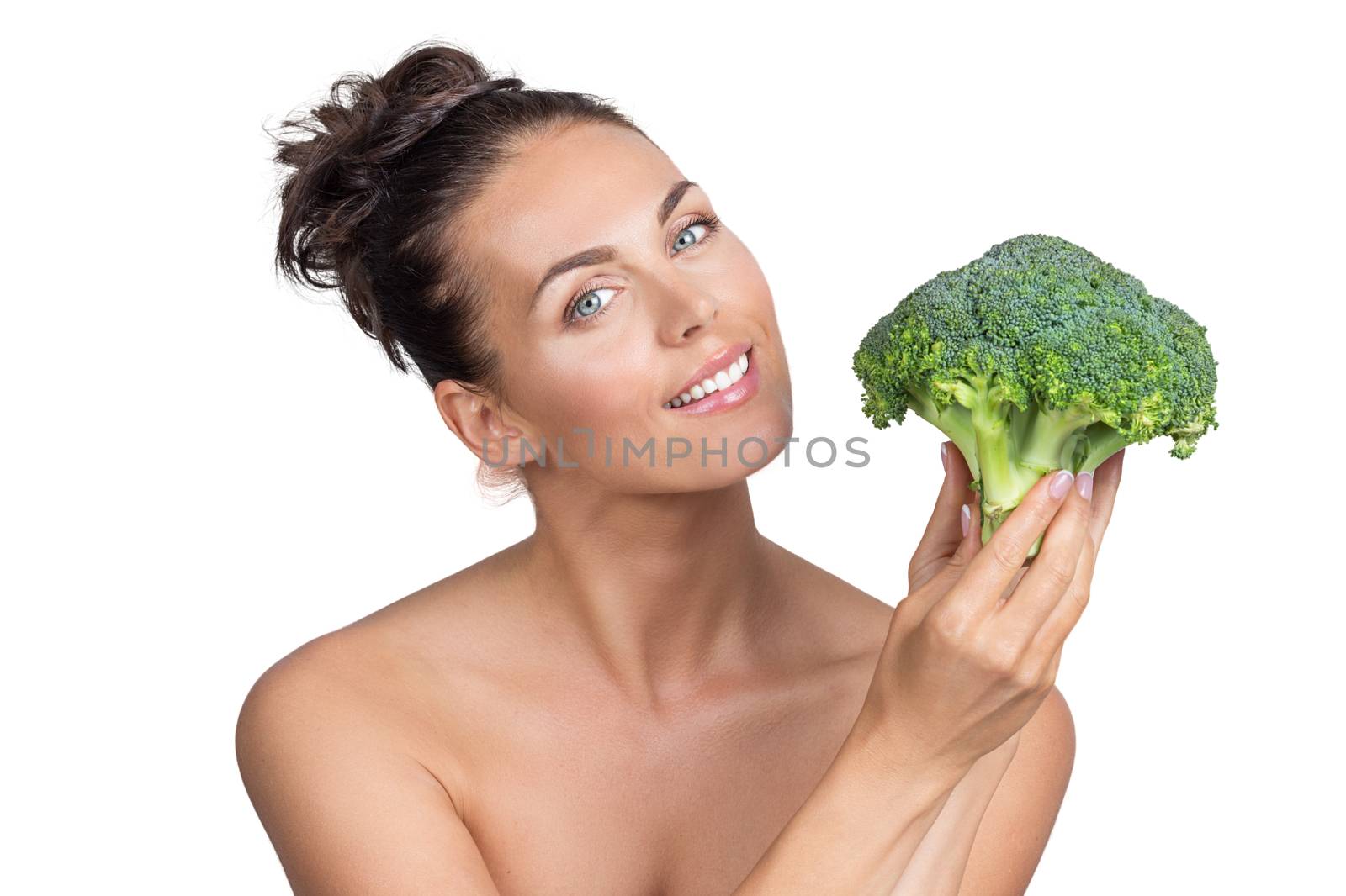 Woman holding broccoli by ALotOfPeople