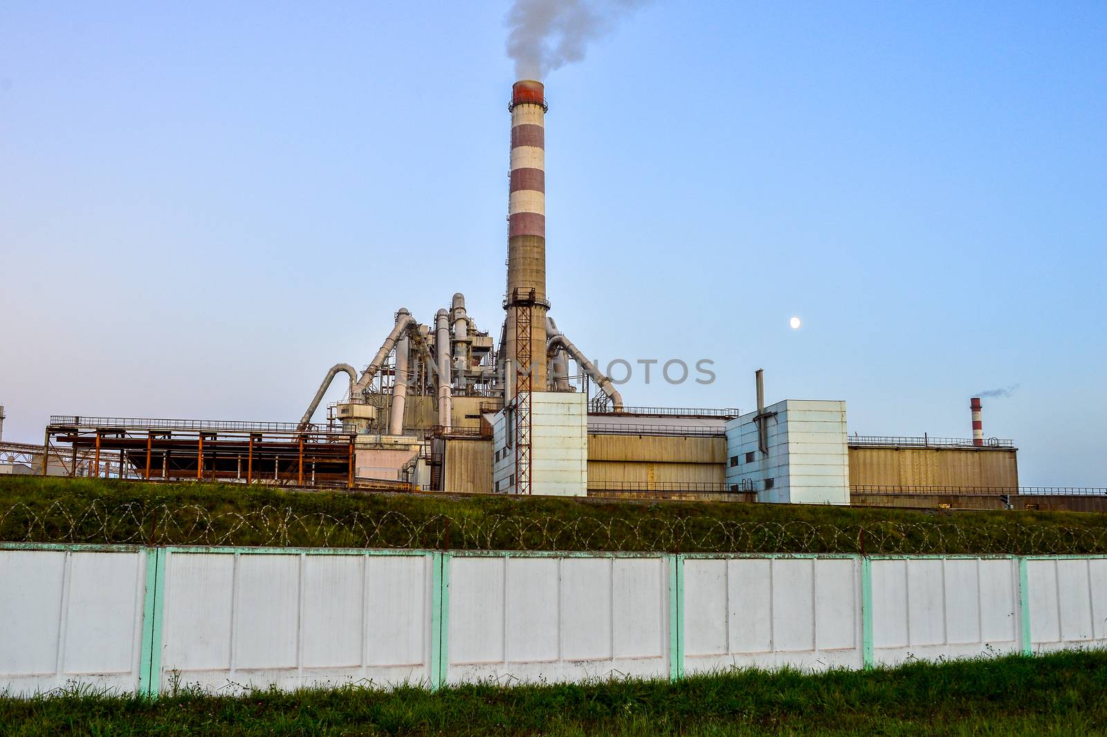 Pollution of atmospheric air from the chimneys of plants.