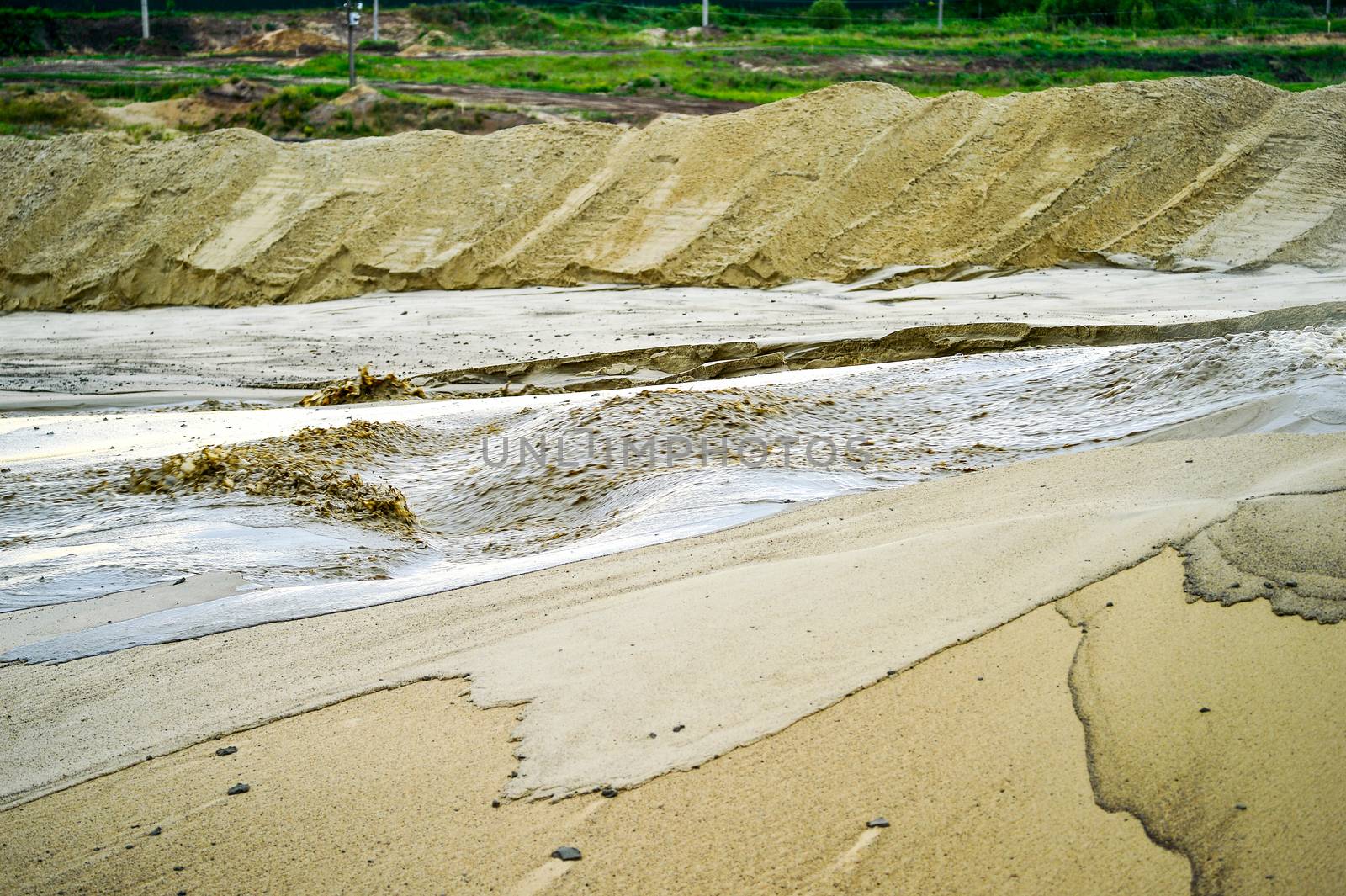 Extraction of sand, sand pit with water.