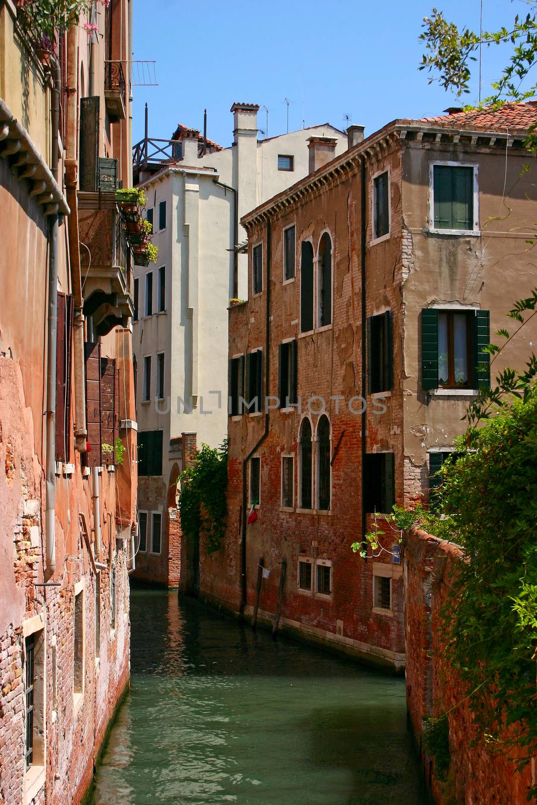 Small canal in the beautiful and romantic Venice