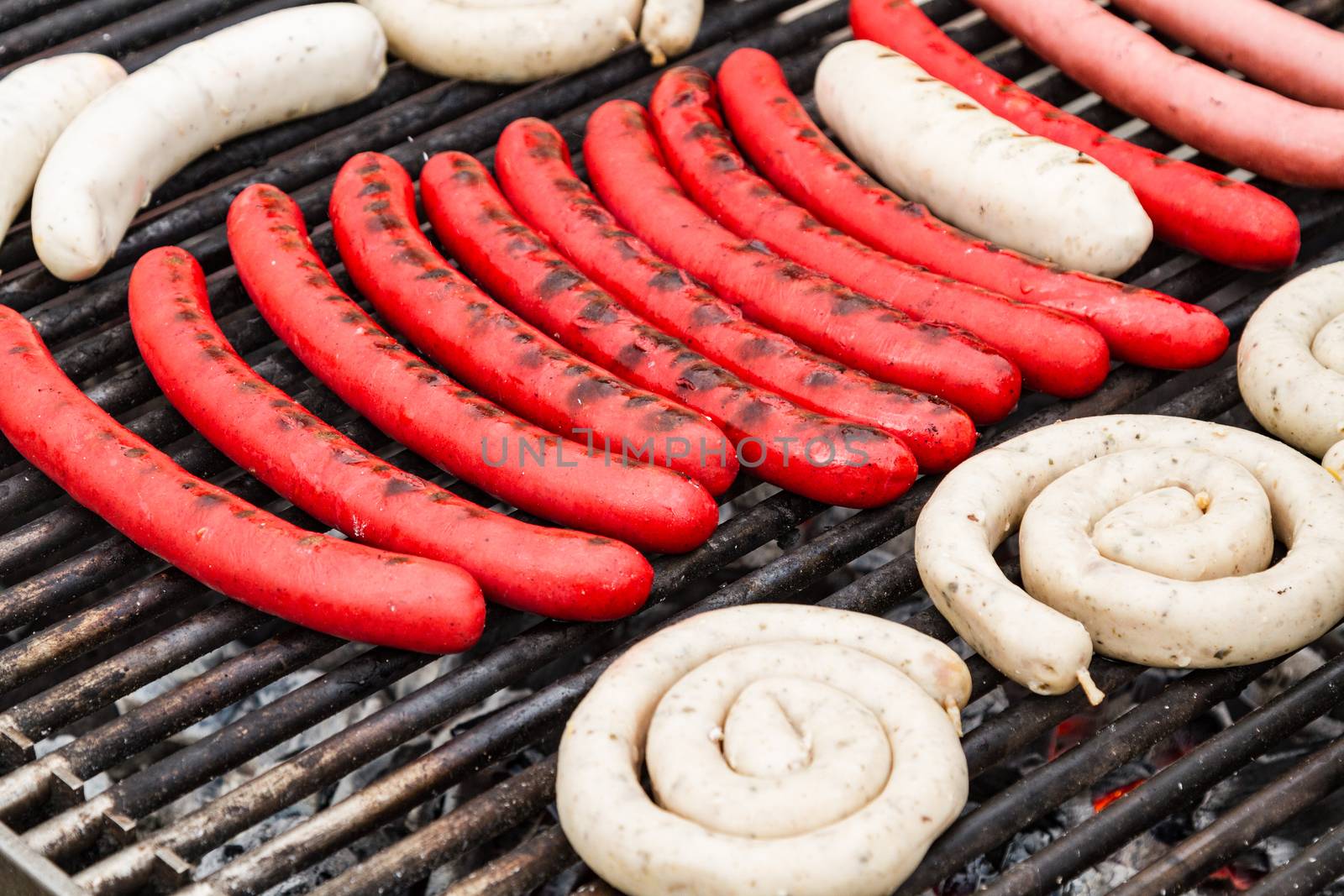 Closeup shot of the sausages on a grill