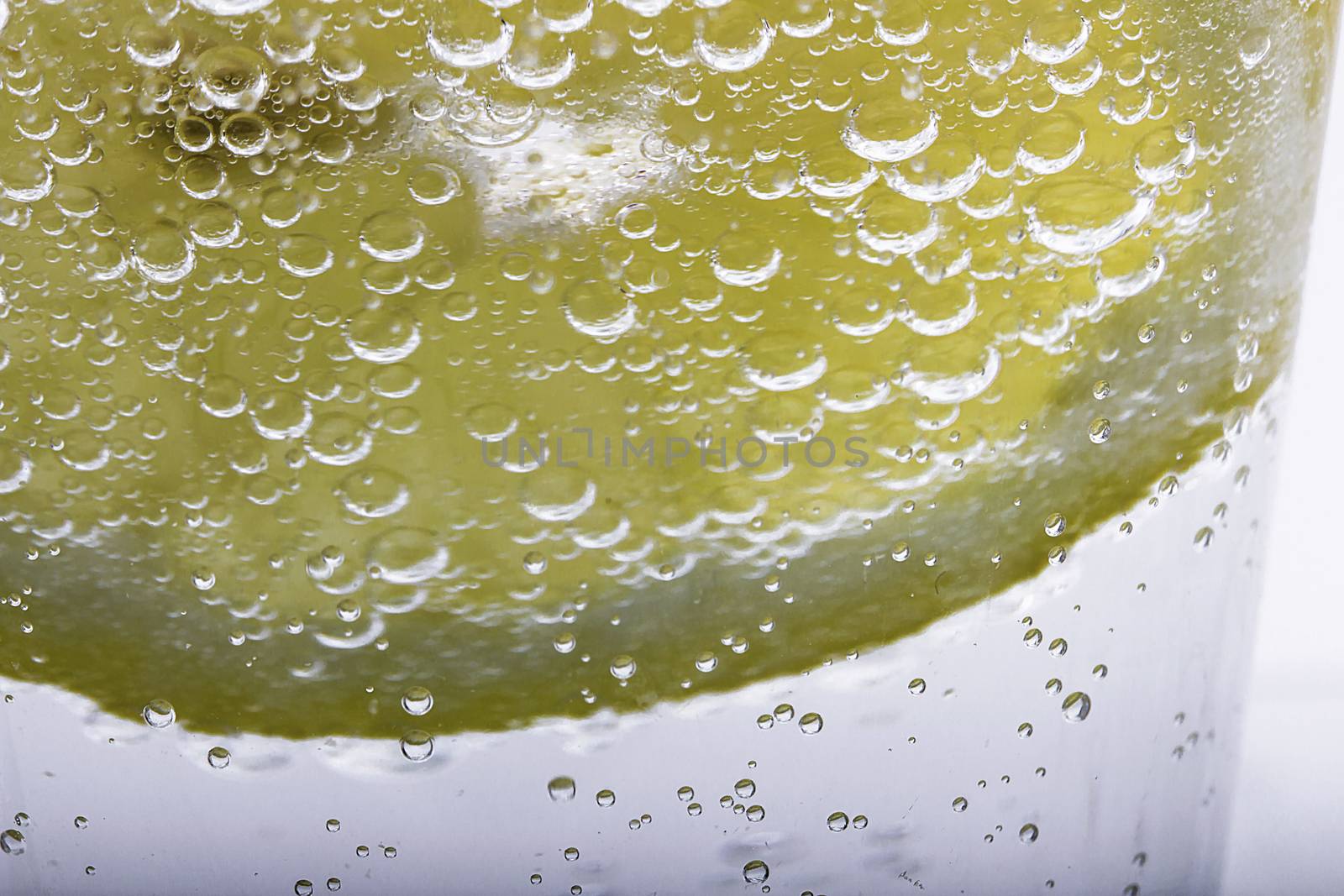 Slice Of Lemon In Mineral Water Bubbles 