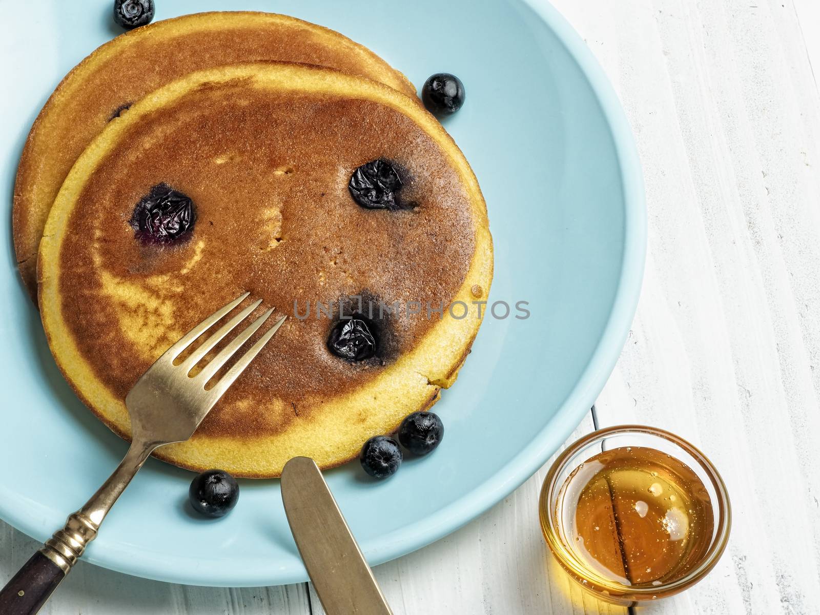 close up of rustic golden blueberry pancake