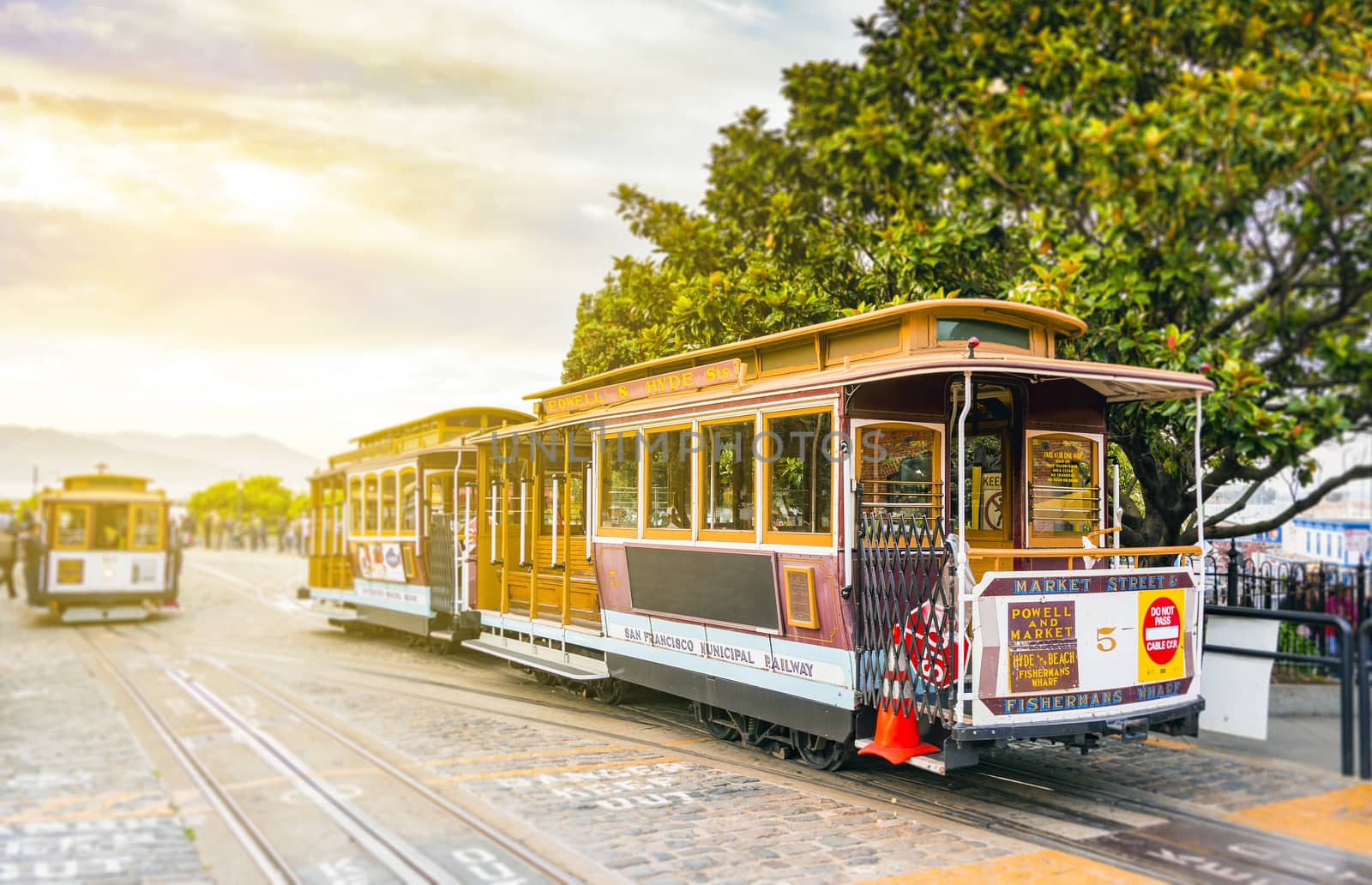 traditional San Francisco cable car standing at the terminus in Fisherman Wharf with blurred background