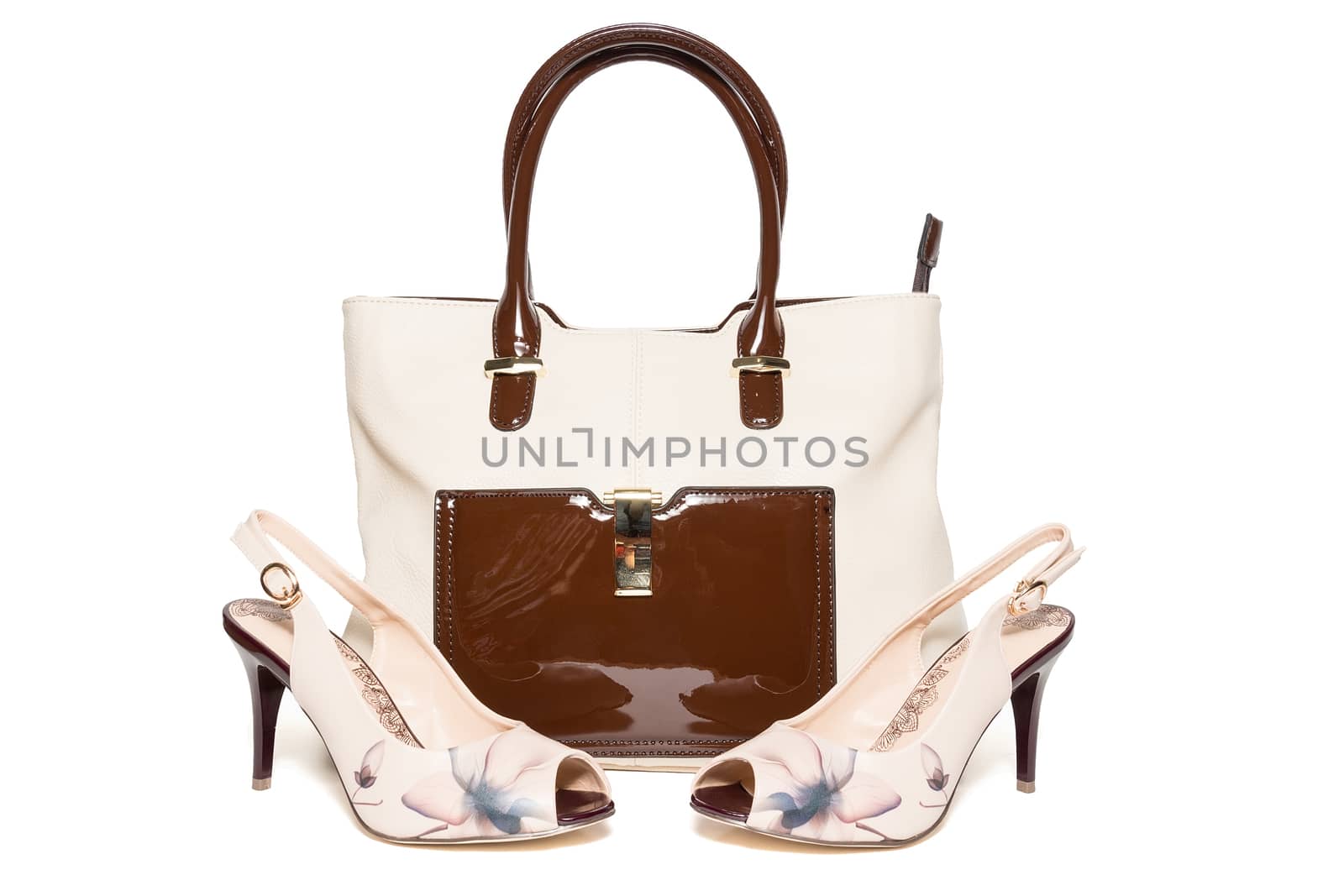 Bag and shoes of beige color on a white background