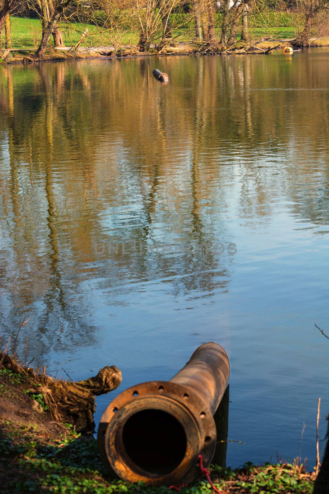 Pipeline, plastic pipes float on the water surface.