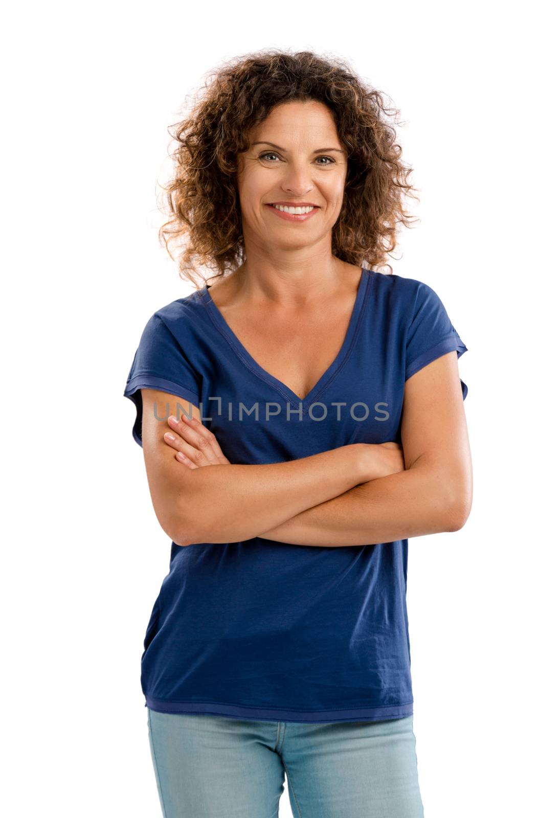 Smiling middle aged woman with arms folded, isolated on white background