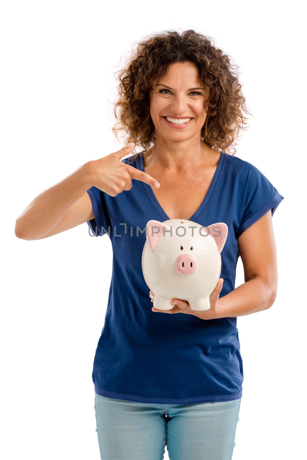 Portrait of a happy middle aged woman pointing to a Piggybank