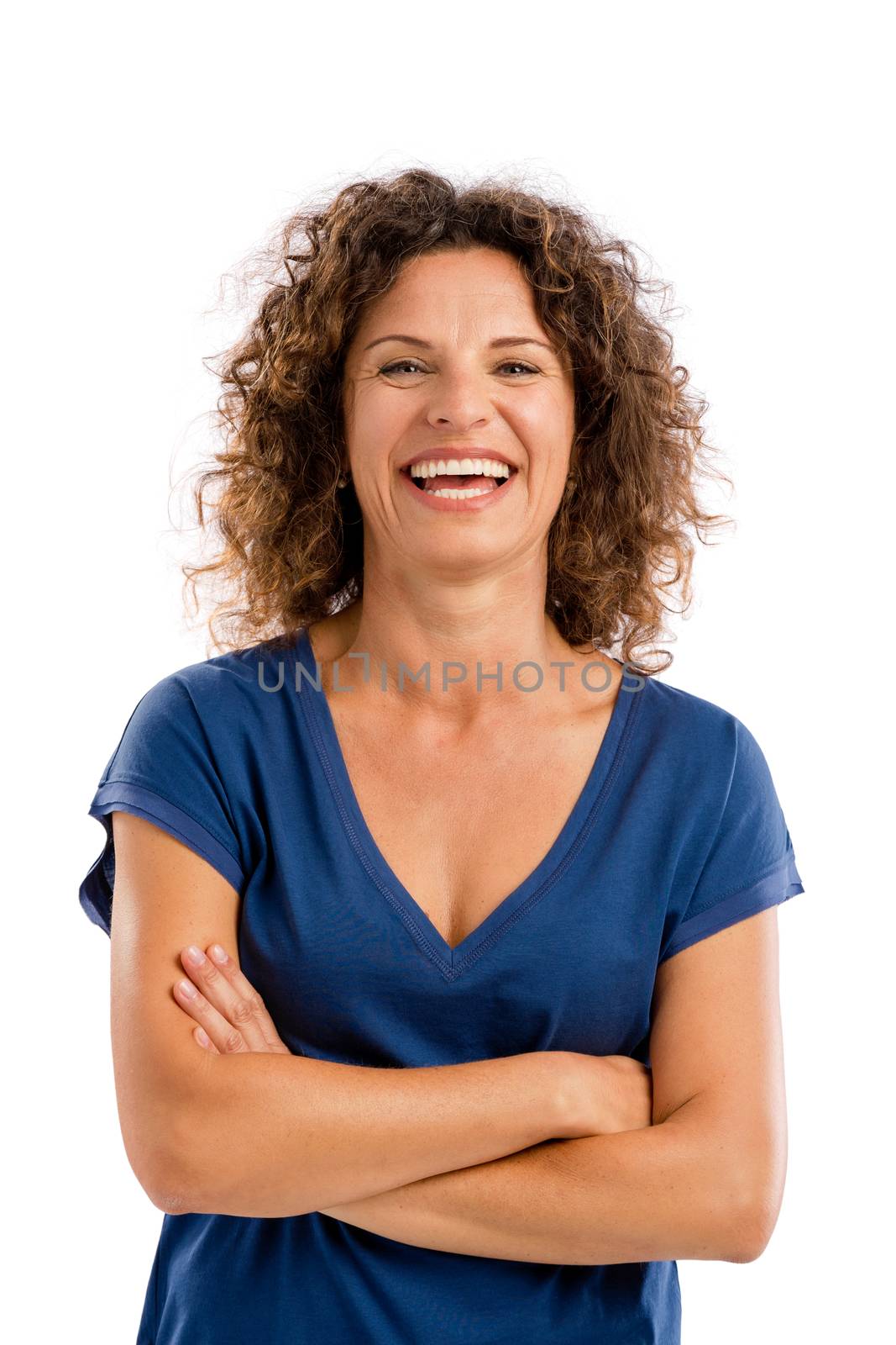 Smiling middle aged woman with arms folded, isolated on white background