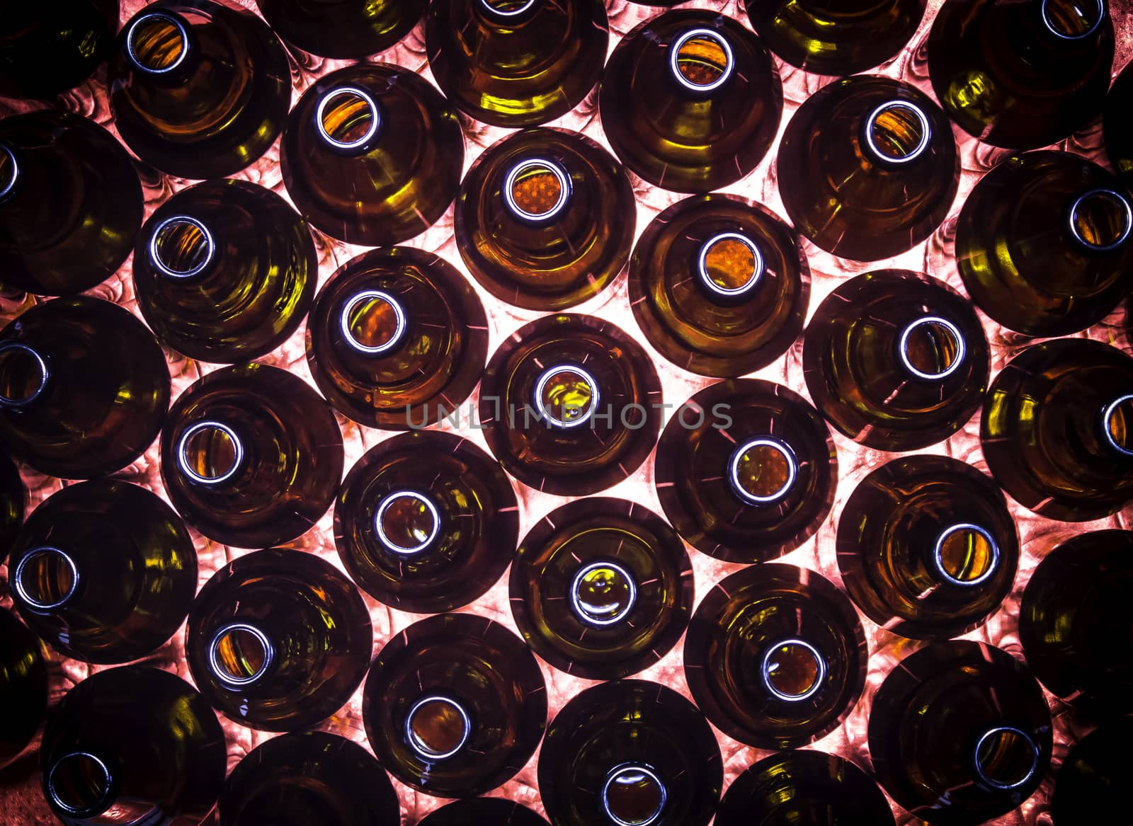 Closeup circular rows of brown color bottles background