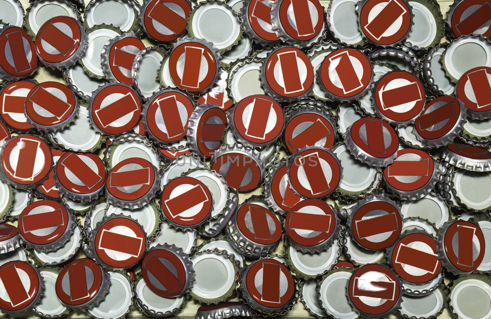 Large pile of beer bottle caps background