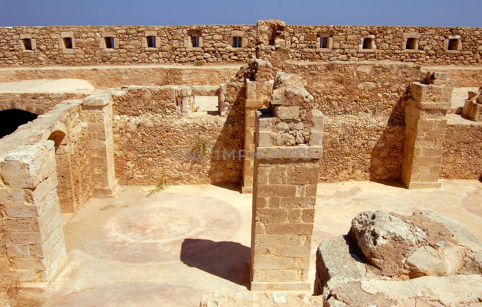wall and column in Firka fortress at sun day, Crete.