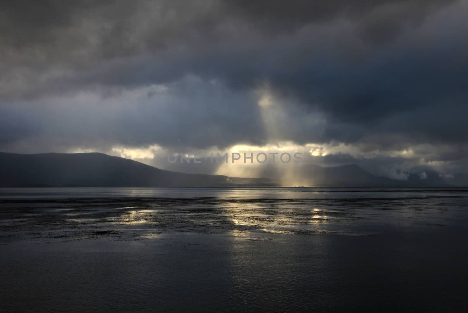 Beagle Channel with beautiful atmosphere of clouds and sun, Tierra del Fuego, Argentina by cicloco