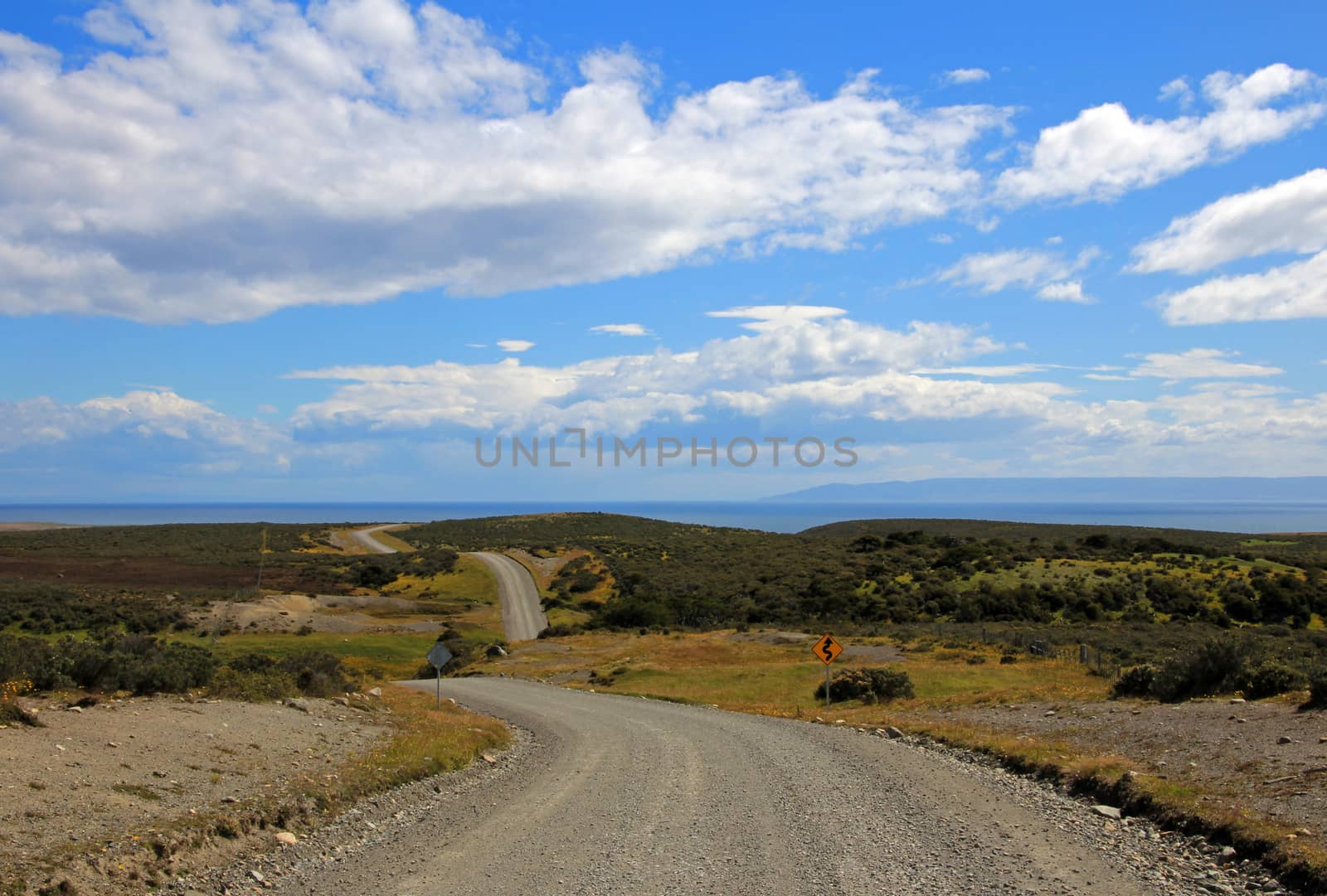 Gravel road trough landscape in Tierra del Fuego, Patagonia, Chile