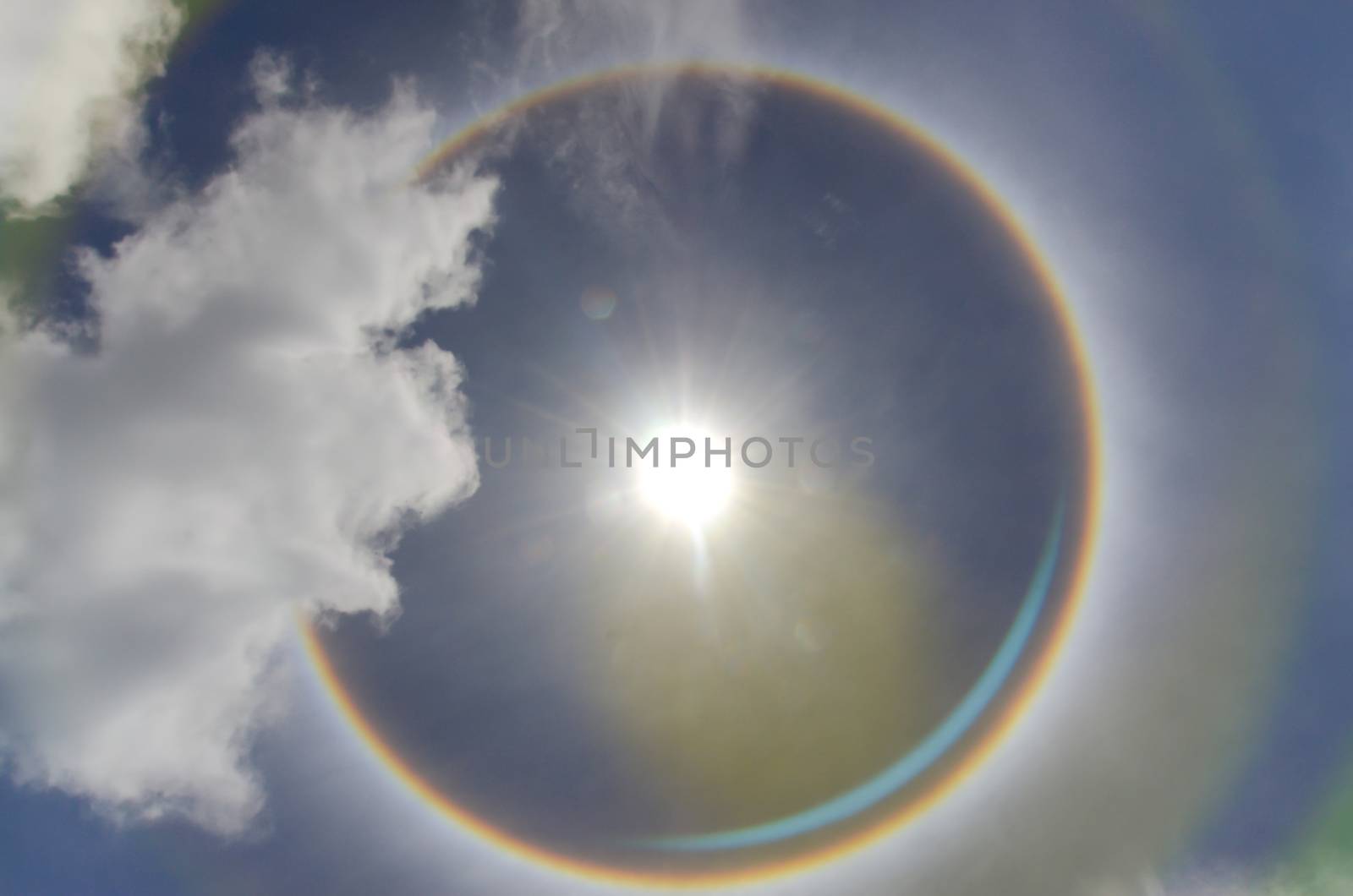 Sun with circular rainbow  sun halo occurring due to ice crystal by metal22