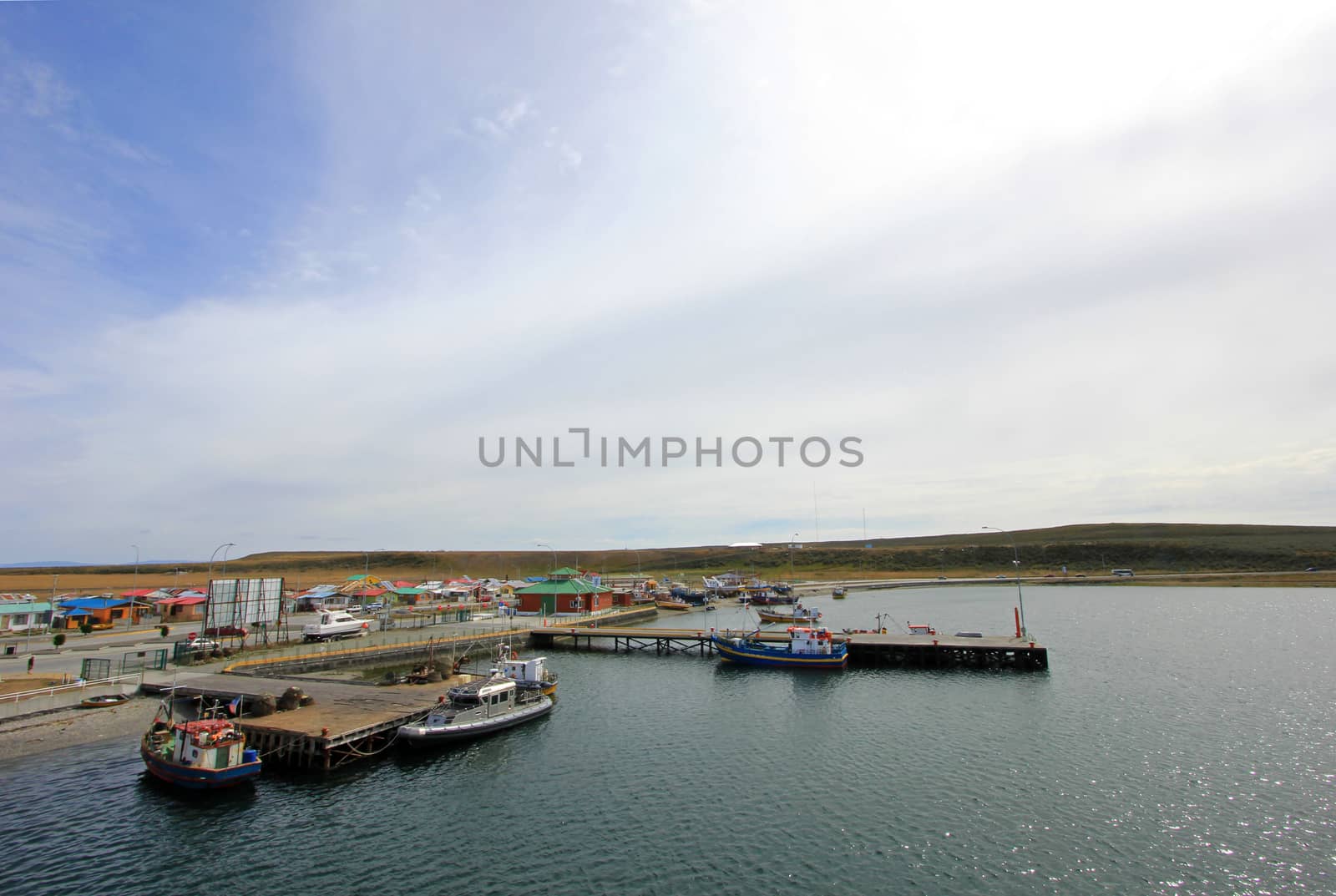 View of boats in the port of Porvenir, Tierra Del Fuego, Chile by cicloco