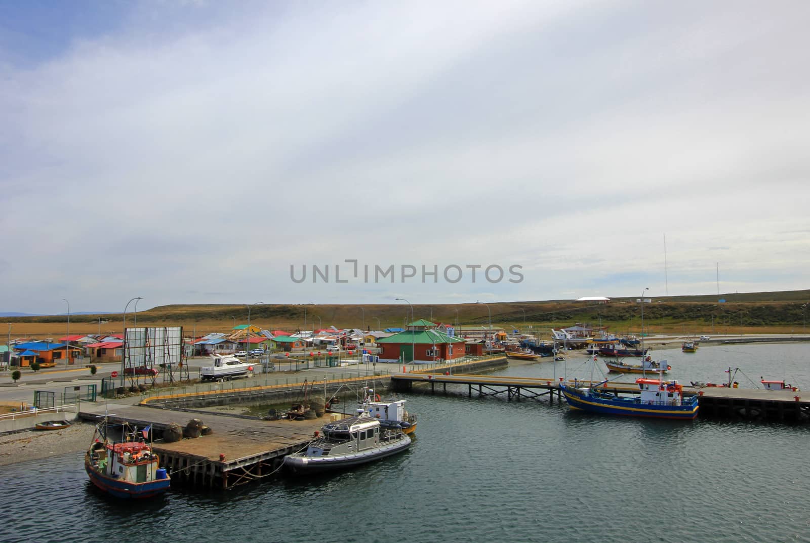 View of boats in the port of Porvenir, Tierra Del Fuego, Chile by cicloco