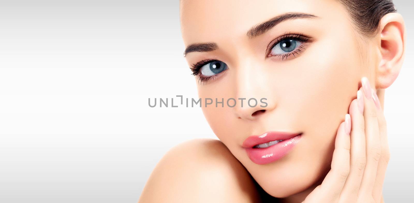 Closeup headshot portrait of a beautiful woman with beauty face by Nobilior