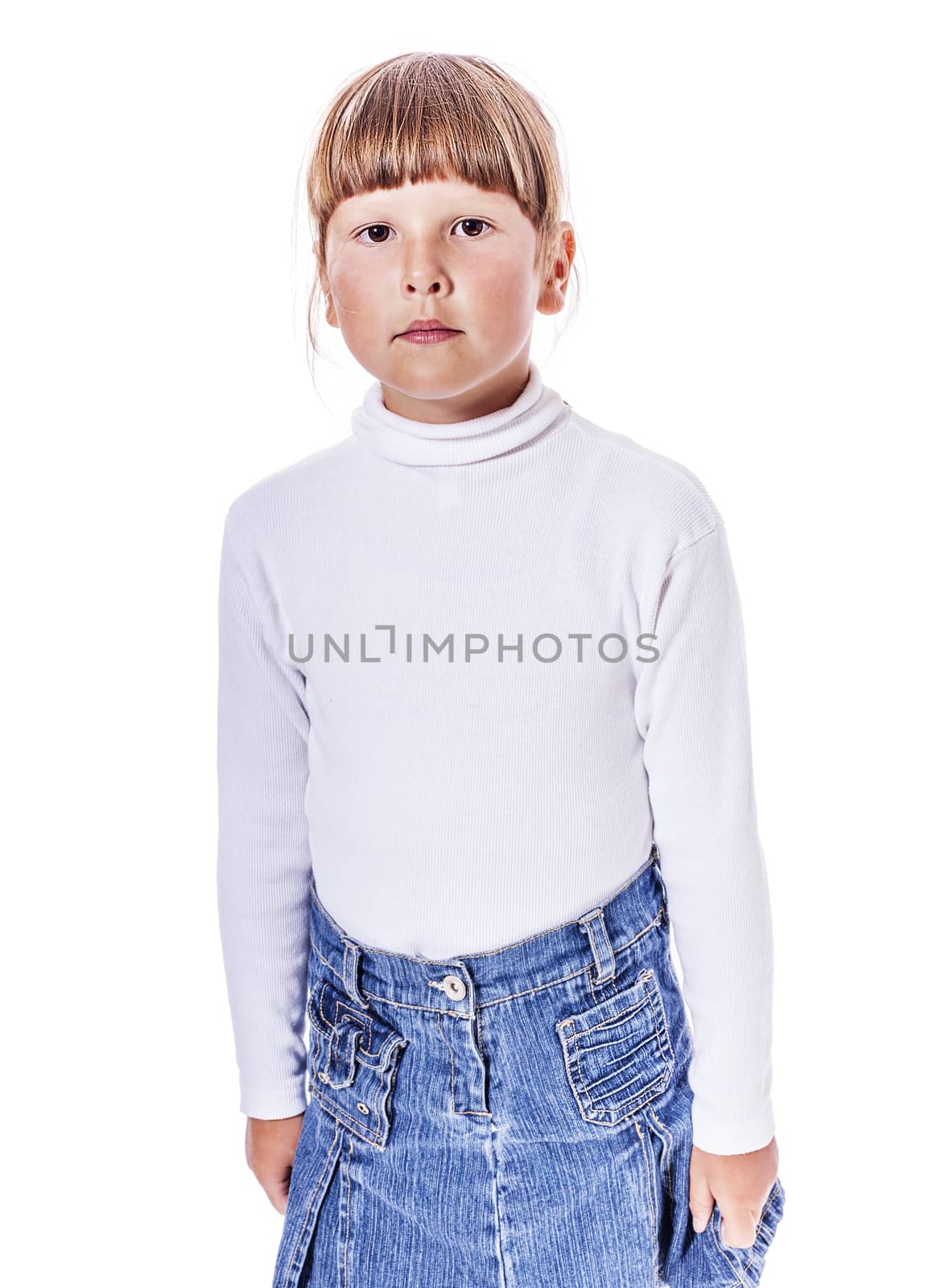 Calm serious six years girl standing isolated on white