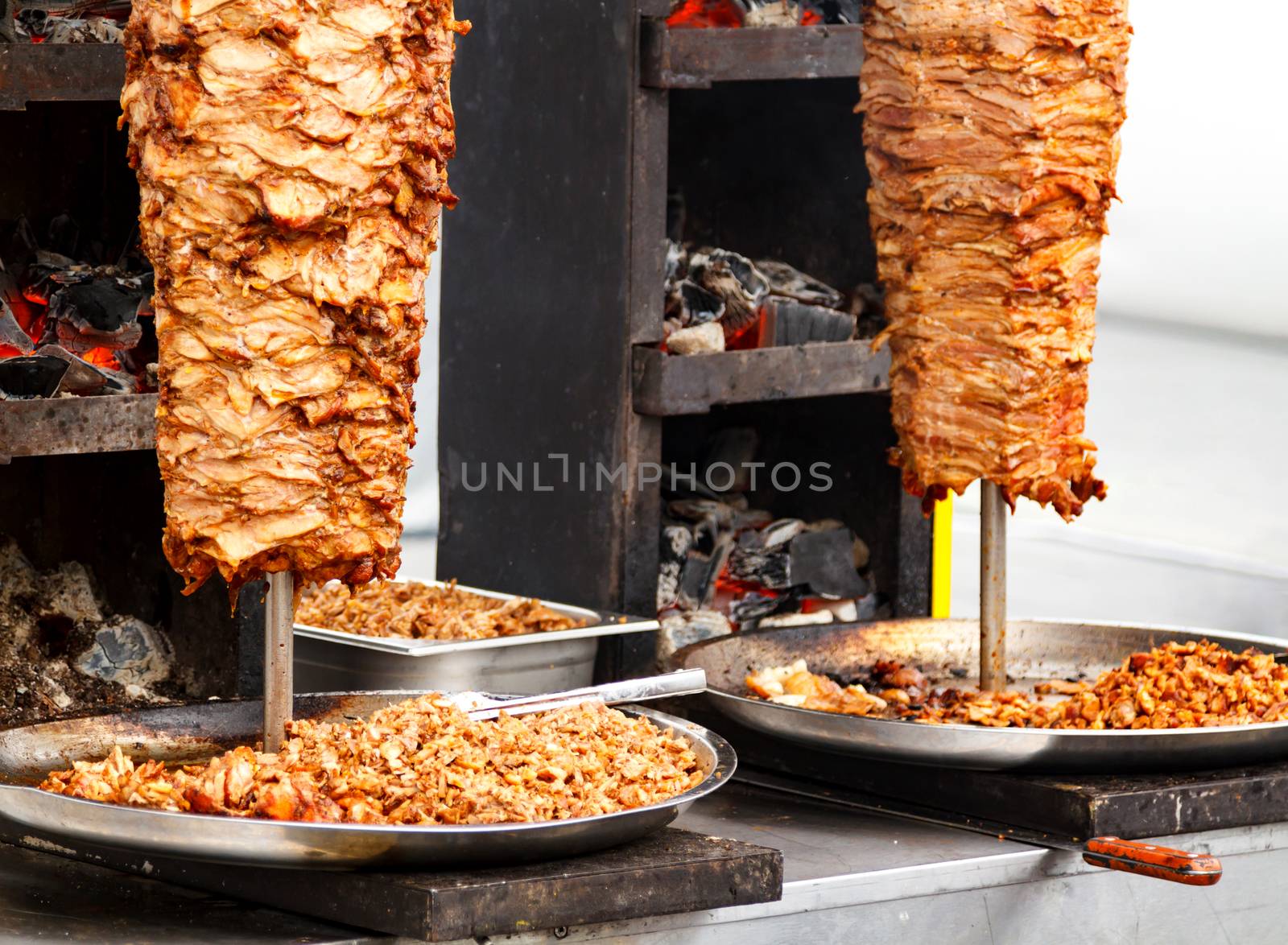 Closeup picture of stacked meat roasting, shawarma by Nobilior