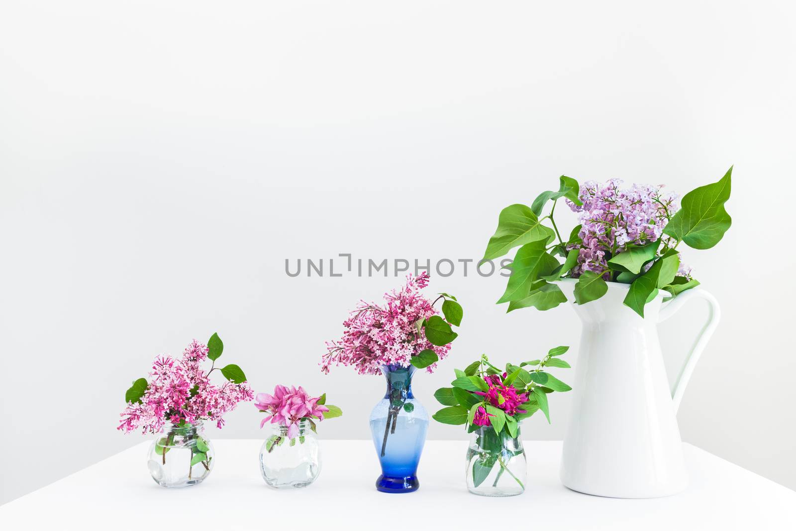 Bouquets of pink and purple spring flowers. Beautiful floral arrangement.