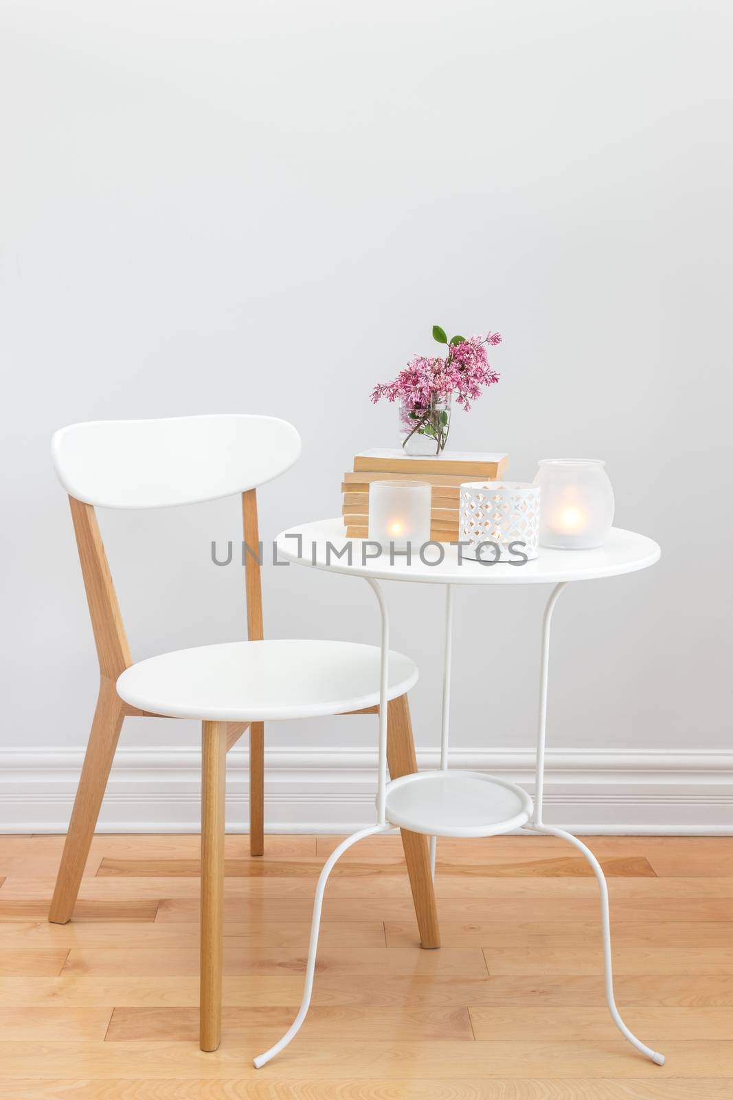 Elegant home decor with candle lights and flowers by anikasalsera