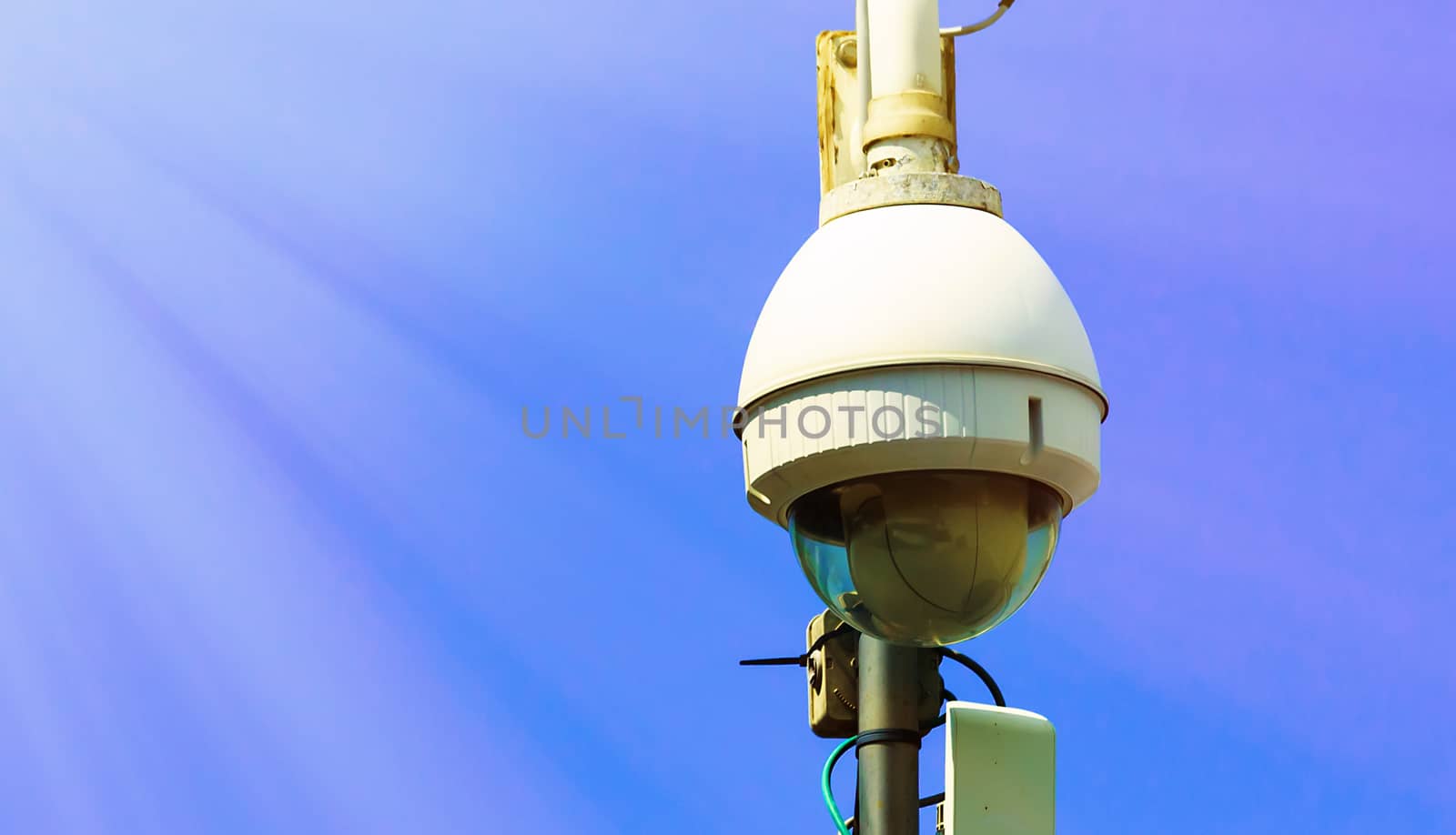 Security CCTV camera under blue sky by pixinoo