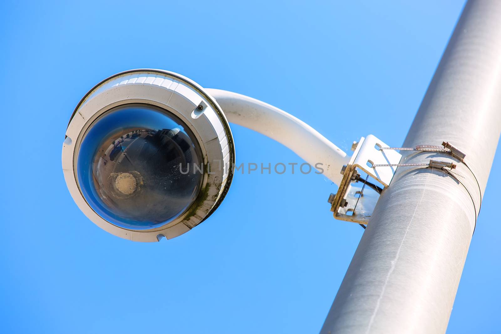 CCTV camera under blue sky seaside for the safety of tourists by pixinoo