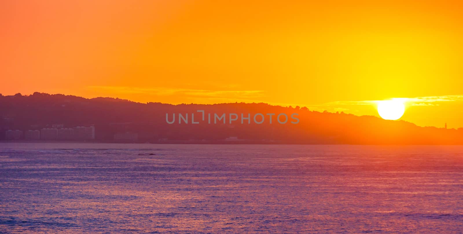 Sea Cliff on sunrise with beautiful dramatic sky and ocean shore by pixinoo