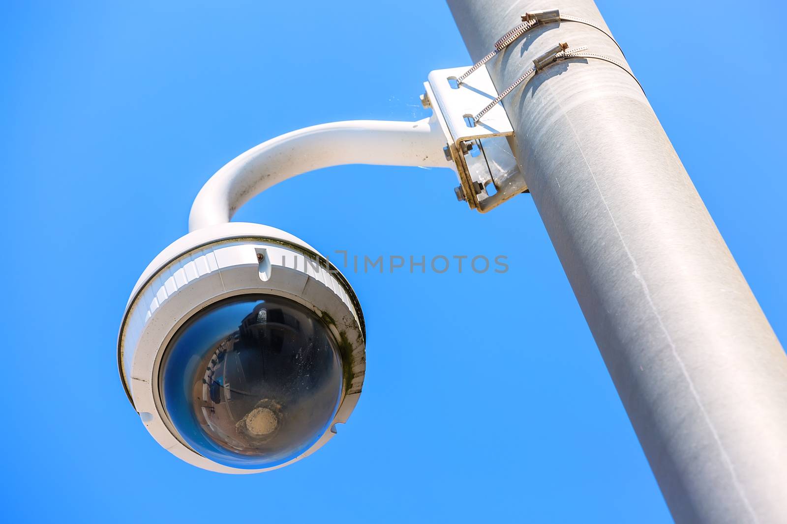 CCTV camera under blue sky seaside for the safety of tourists by pixinoo