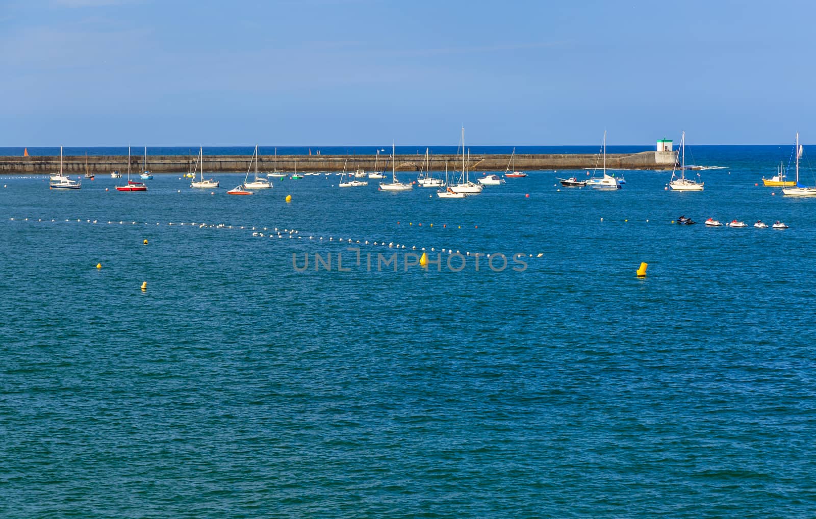 Saint jean de Luz bay with luxurious boats on a sea