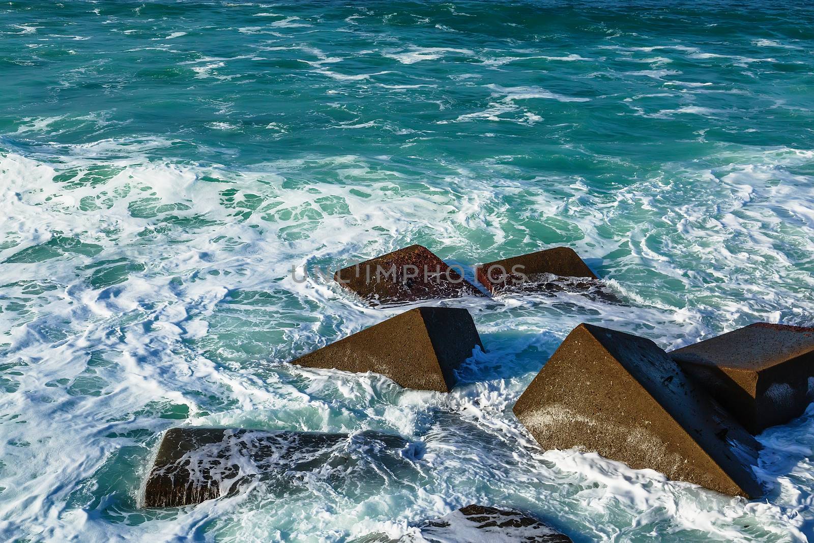 Seascape with rocks, foam and spray of the waves by pixinoo