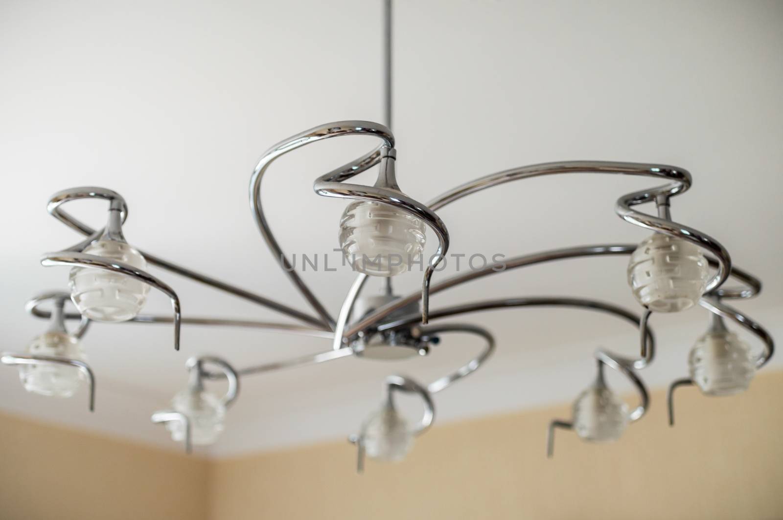 metal chandelierlamp hanging on ceiling by okskukuruza