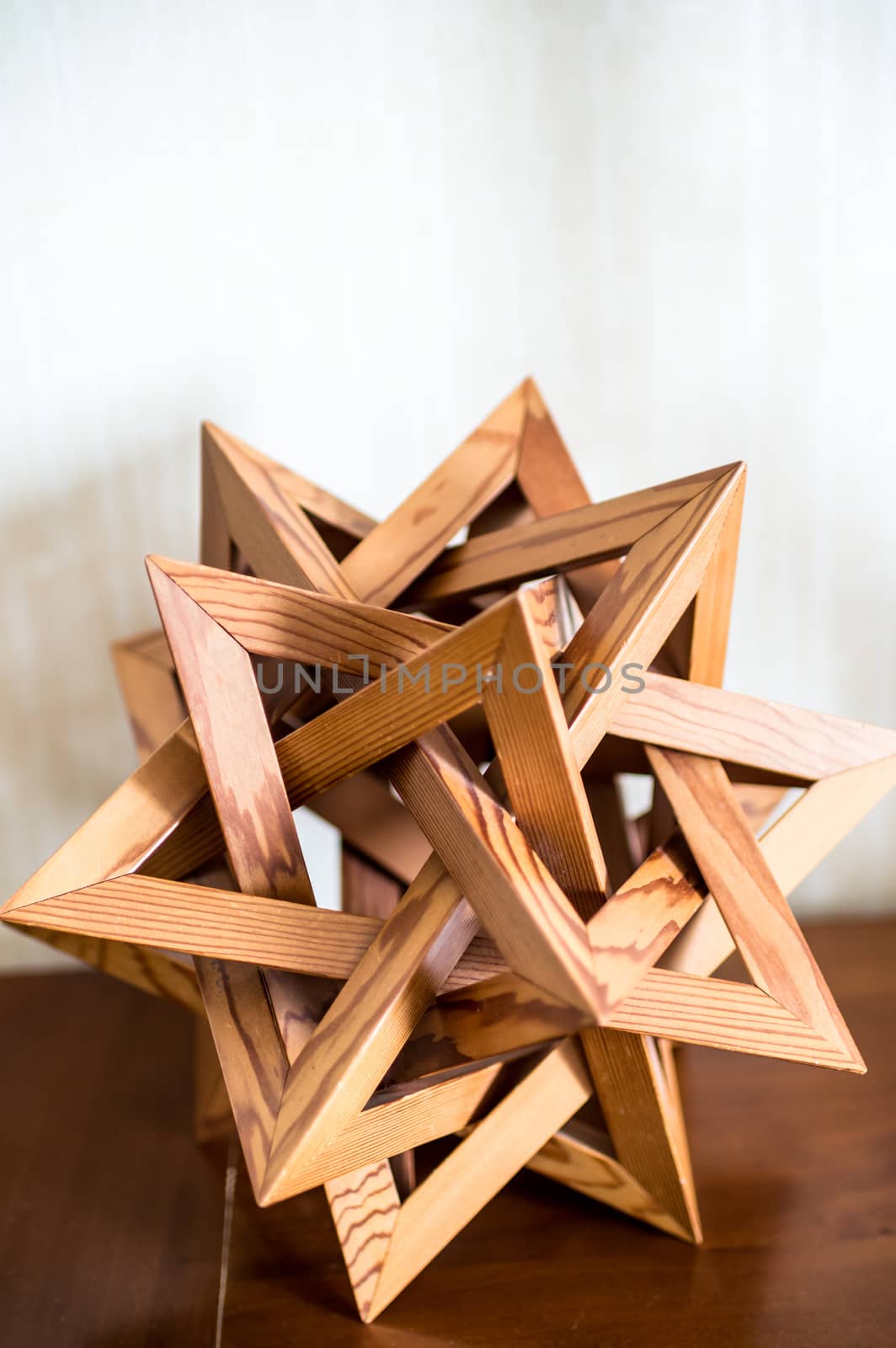 wooden abstraction of triangles on a white background