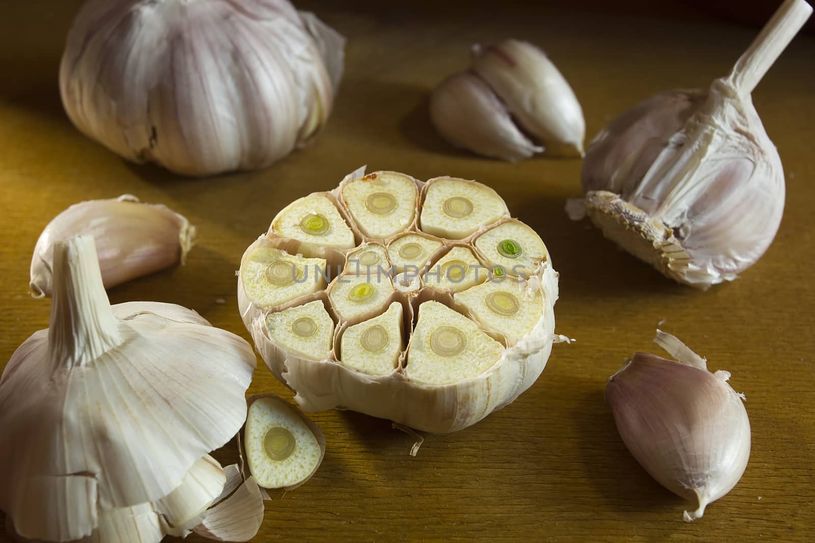 Ripe fresh garlic on a brown wooden table