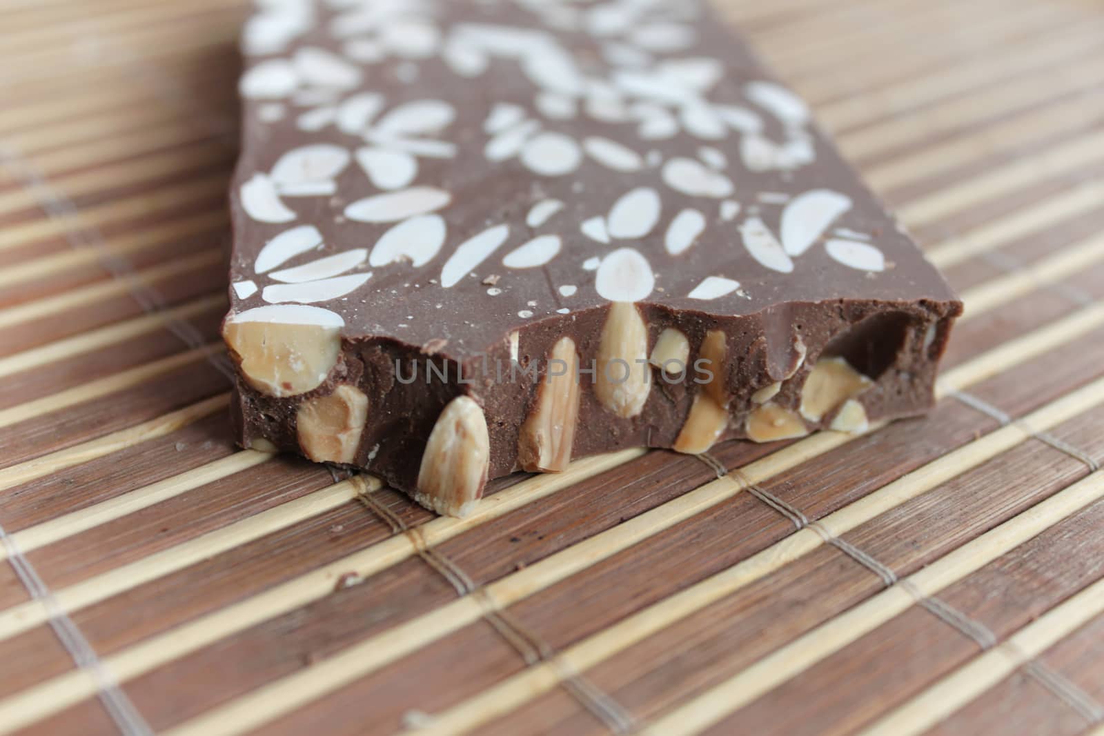 Broken chocolate bar with nuts by Kasia_Lawrynowicz