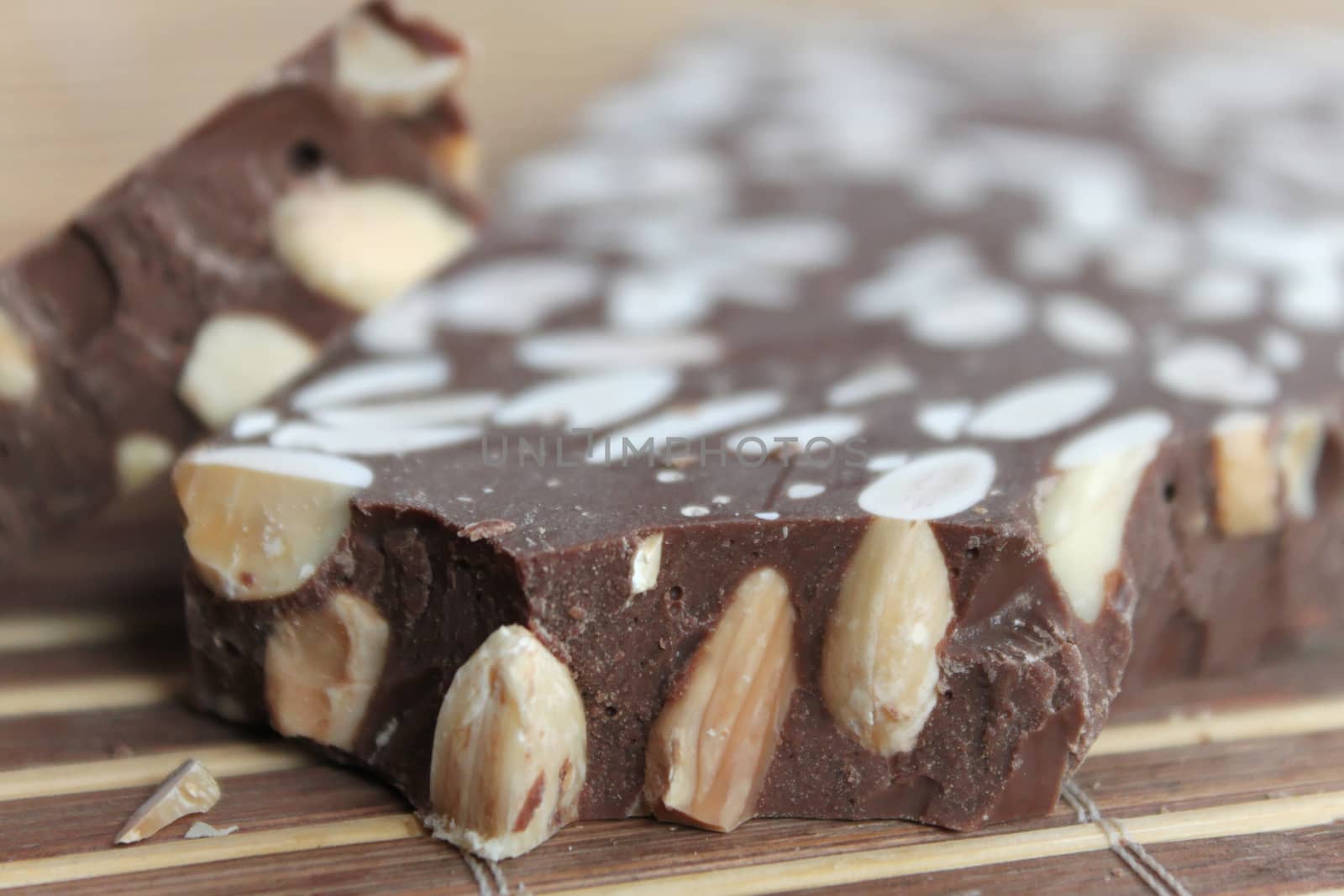 Broken chocolate bar with nuts by Kasia_Lawrynowicz
