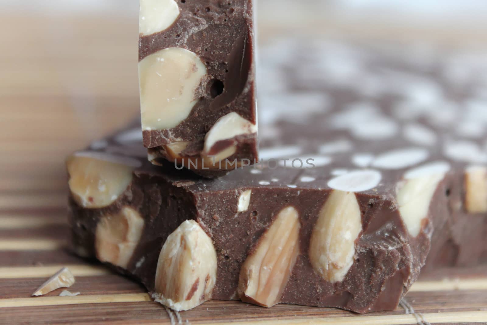 Broken chocolate bar with nuts by Kasia_Lawrynowicz