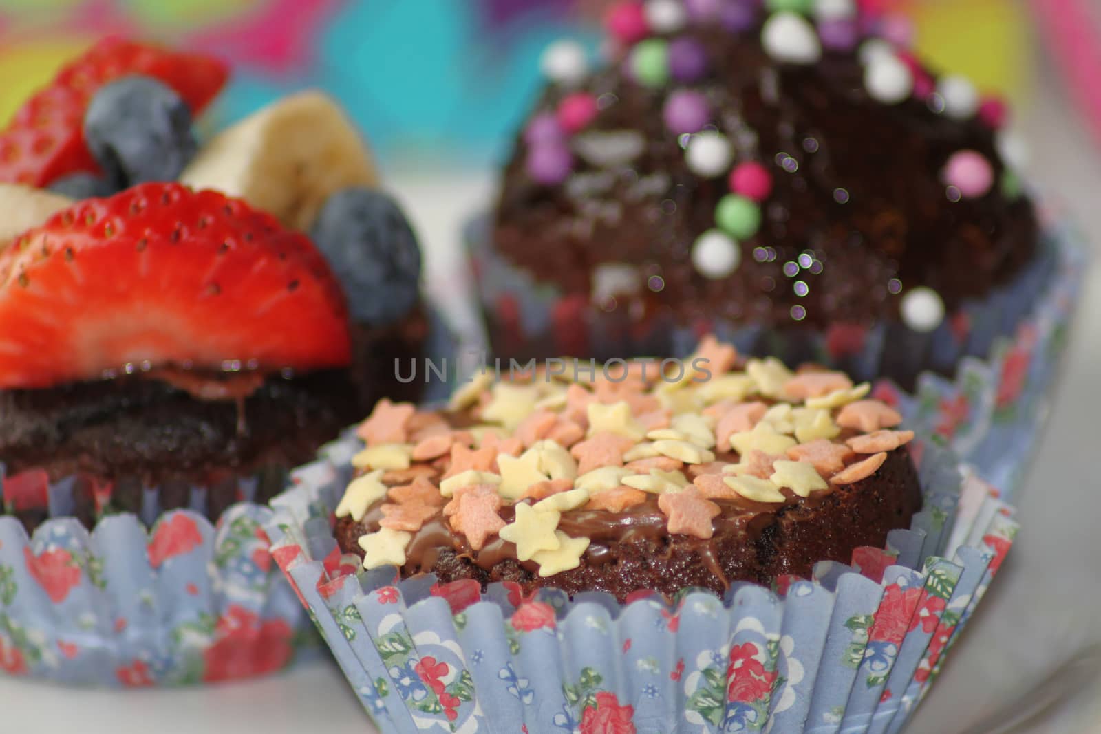 Delicious chocolate muffins with nuts, fruits and sweet balls by Kasia_Lawrynowicz