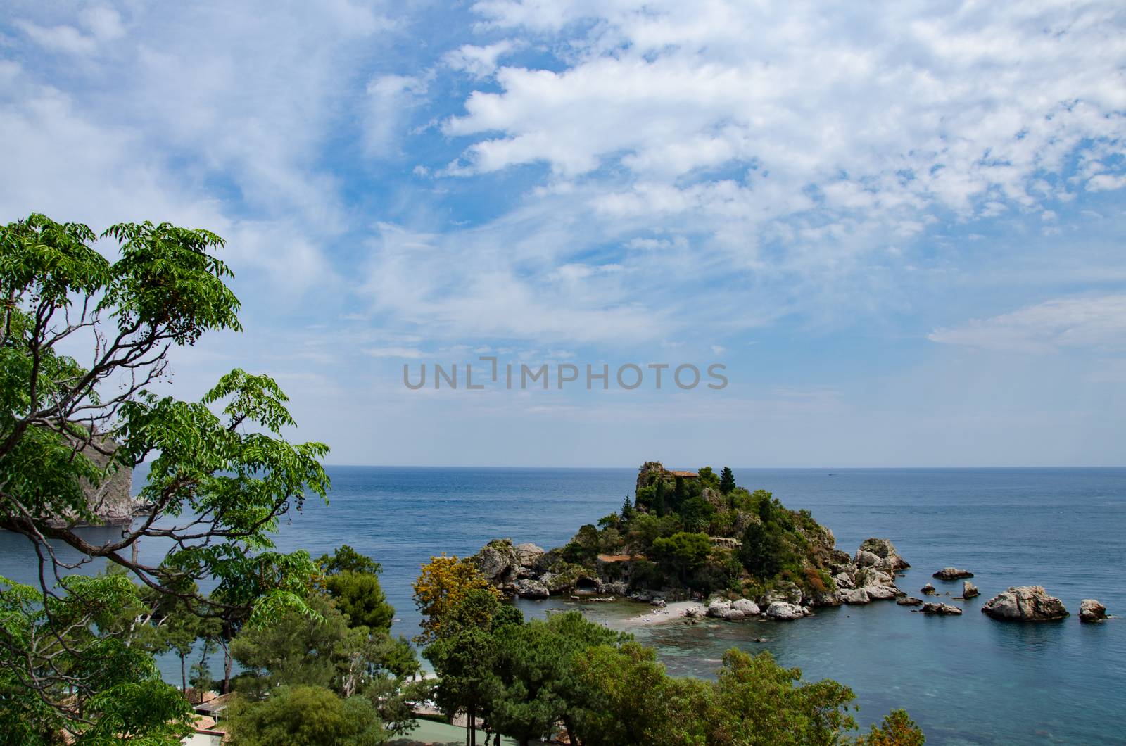 View of island and Isola Bella and blue ocean water in Taormina, Sicily, Italy