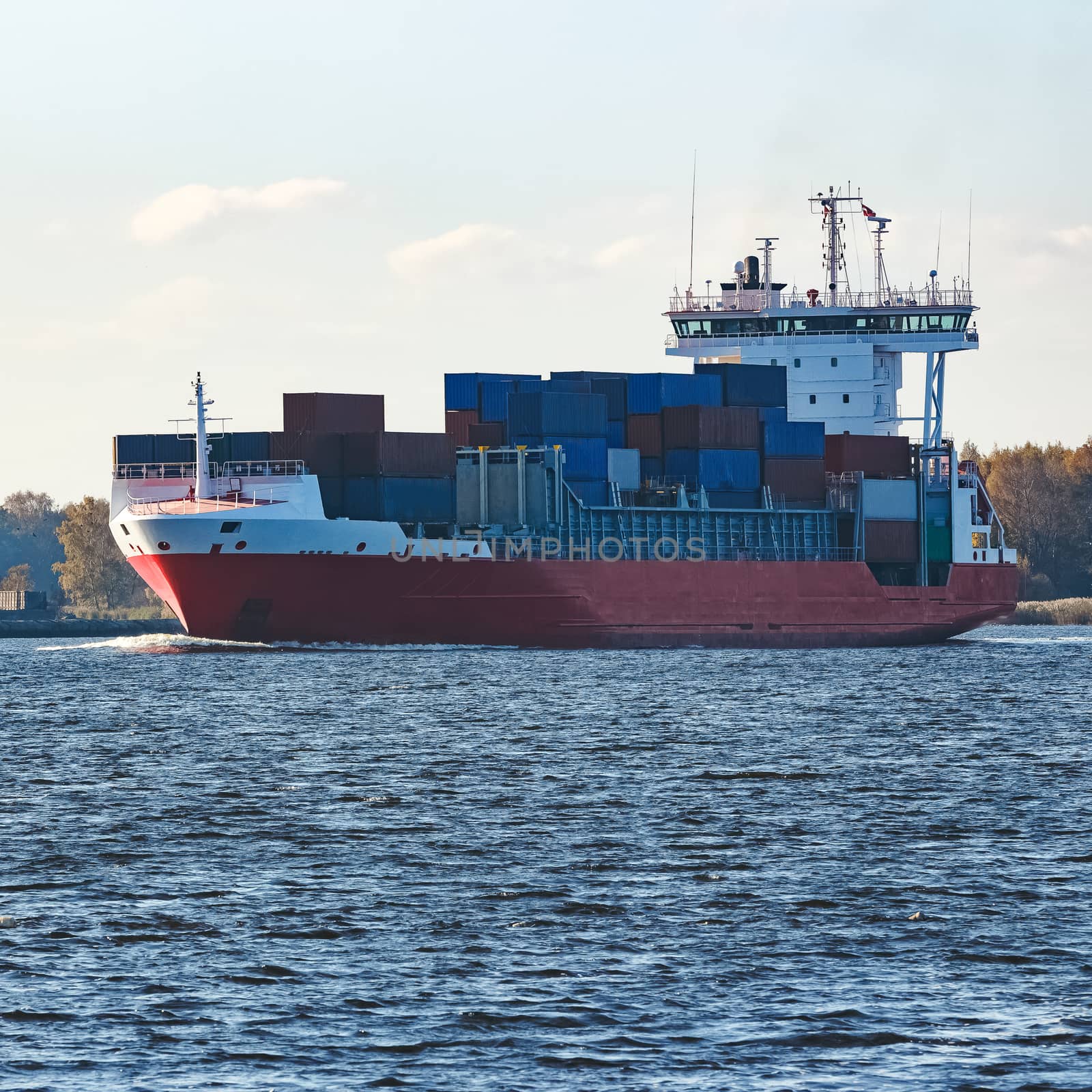 Red container ship sailing to the Baltic sea