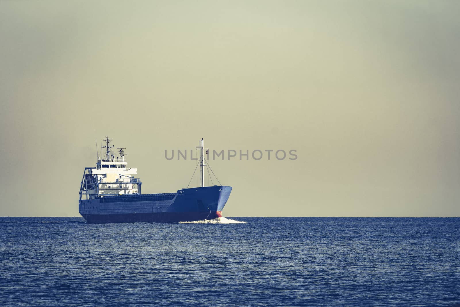 Blue cargo ship sailing from the Baltic sea