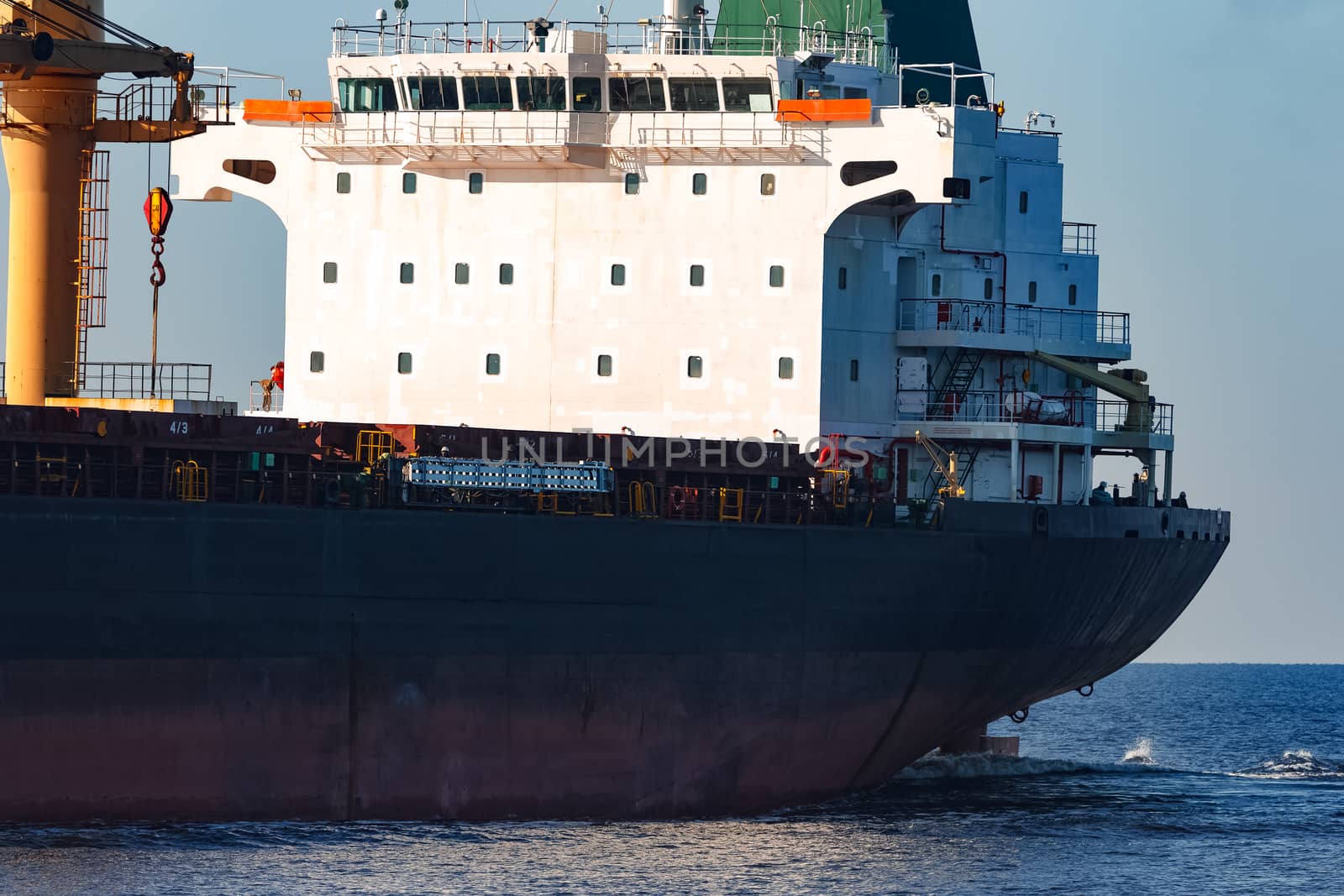 Black cargo ship sailing from the Baltic sea