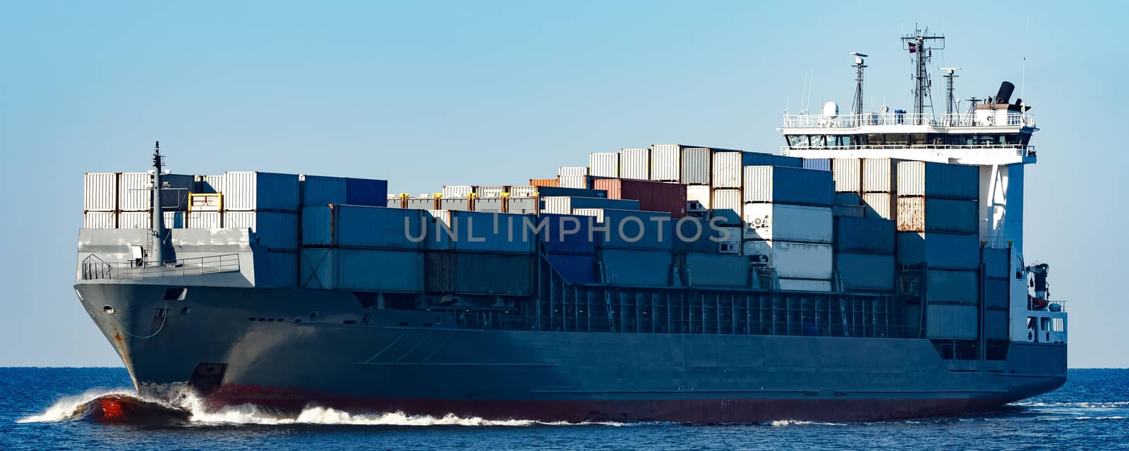 Large grey container ship moving from Baltic sea