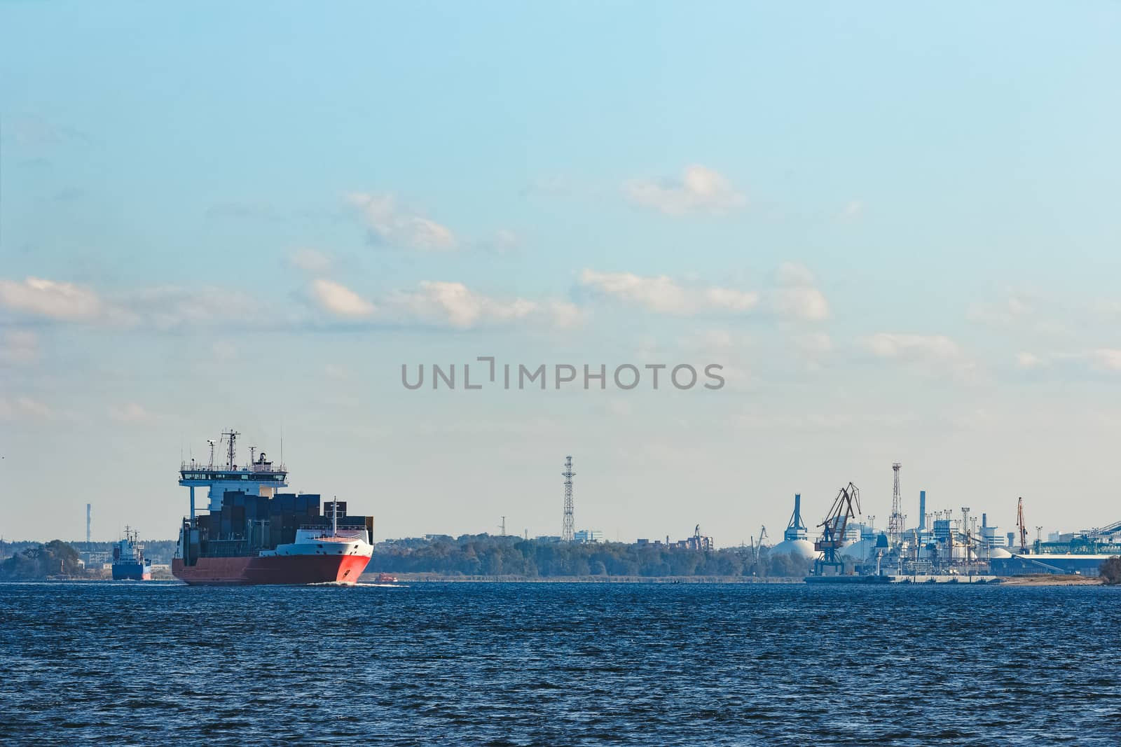 Red container ship sailing to the Baltic sea