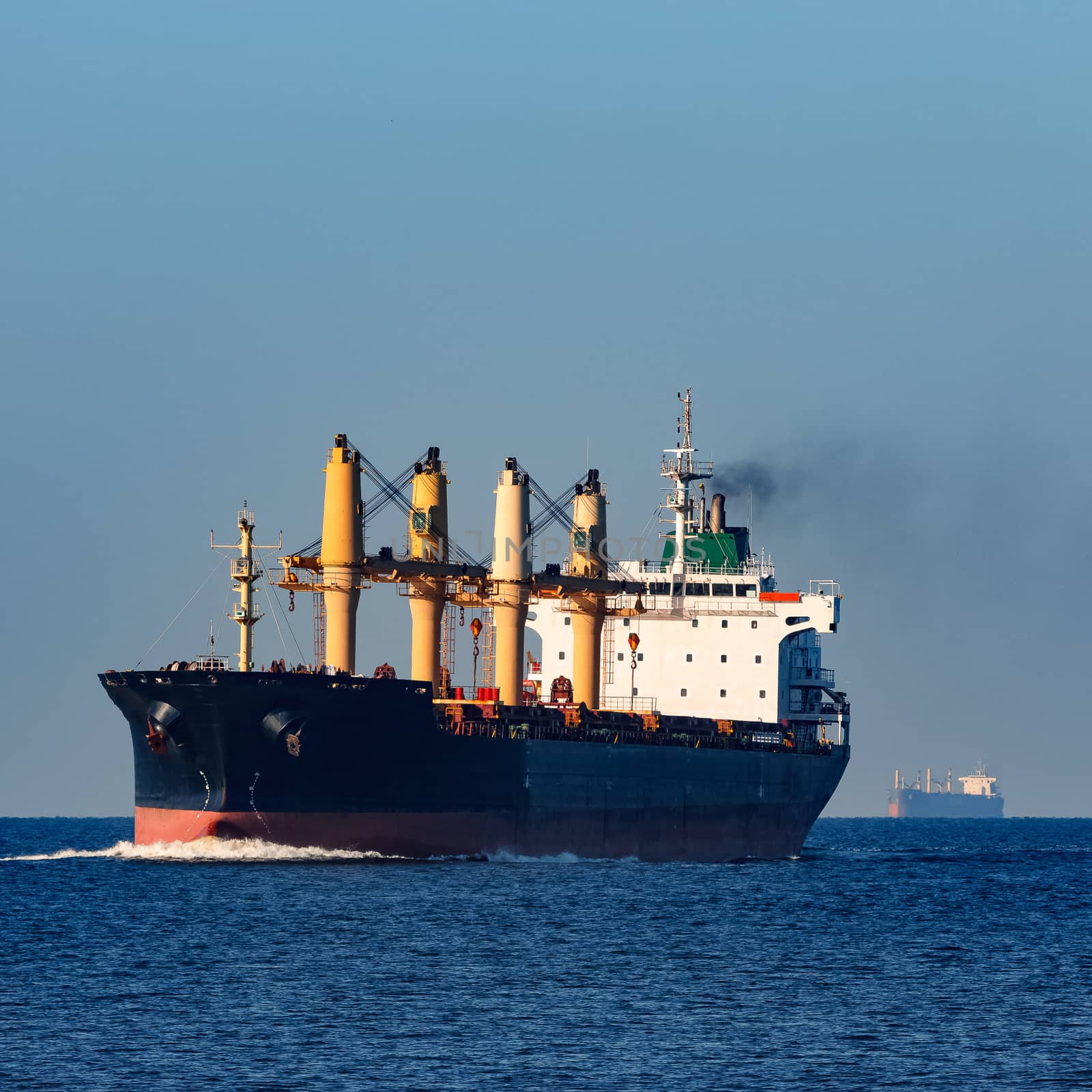 Black cargo ship sailing from the Baltic sea