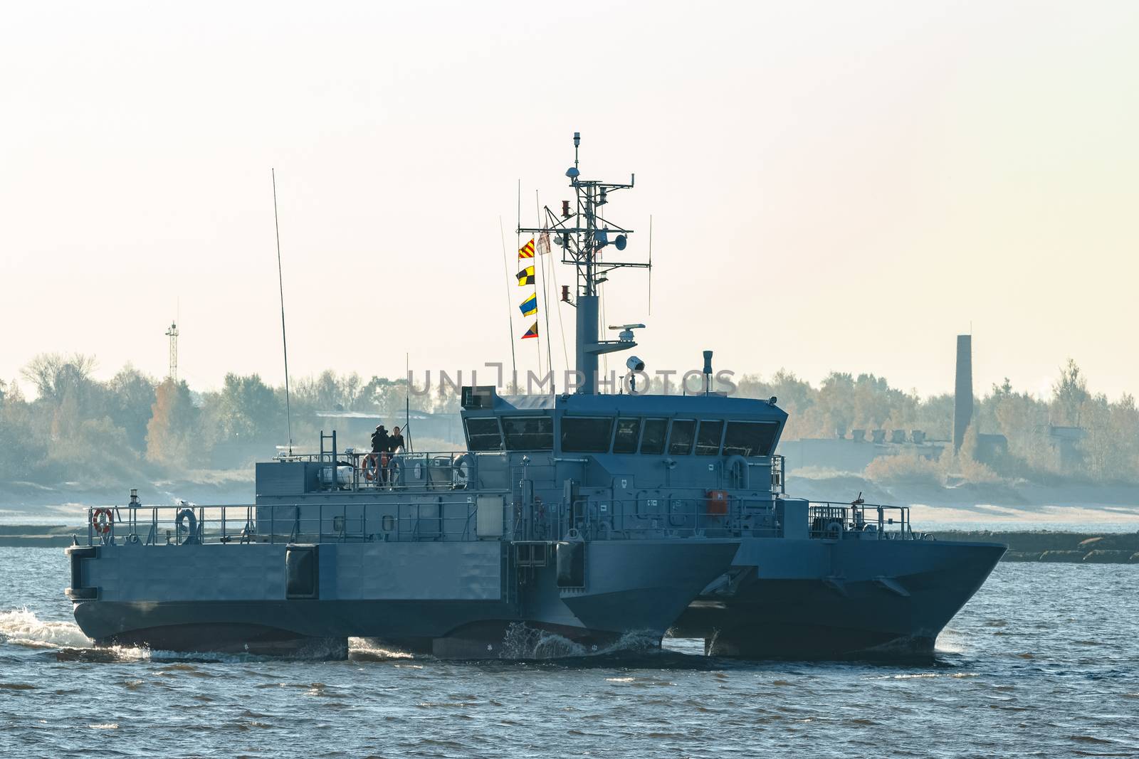 Small grey military ship moving from Baltic sea