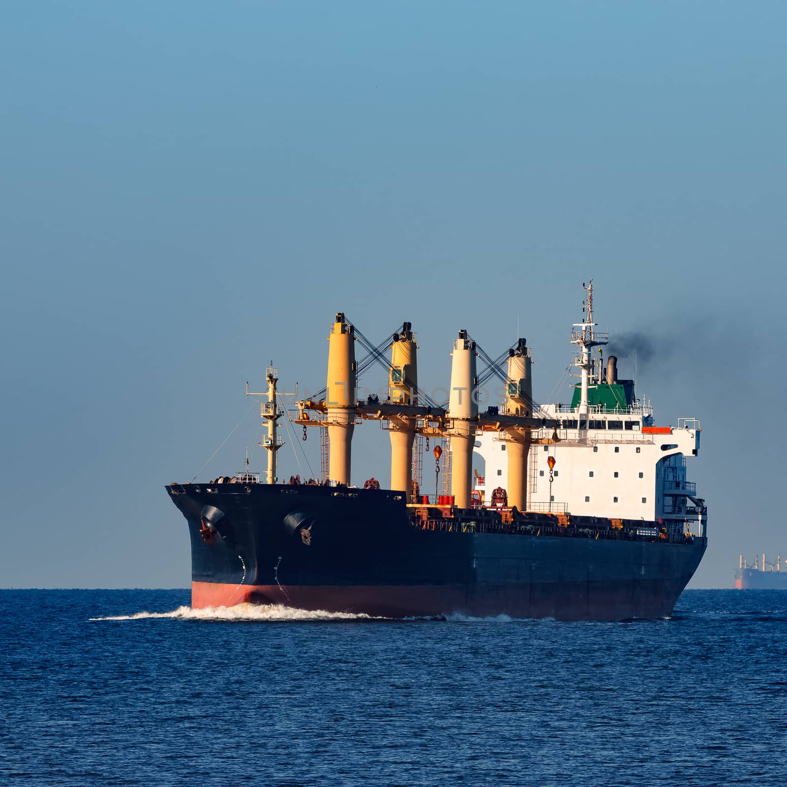 Black cargo ship sailing from the Baltic sea